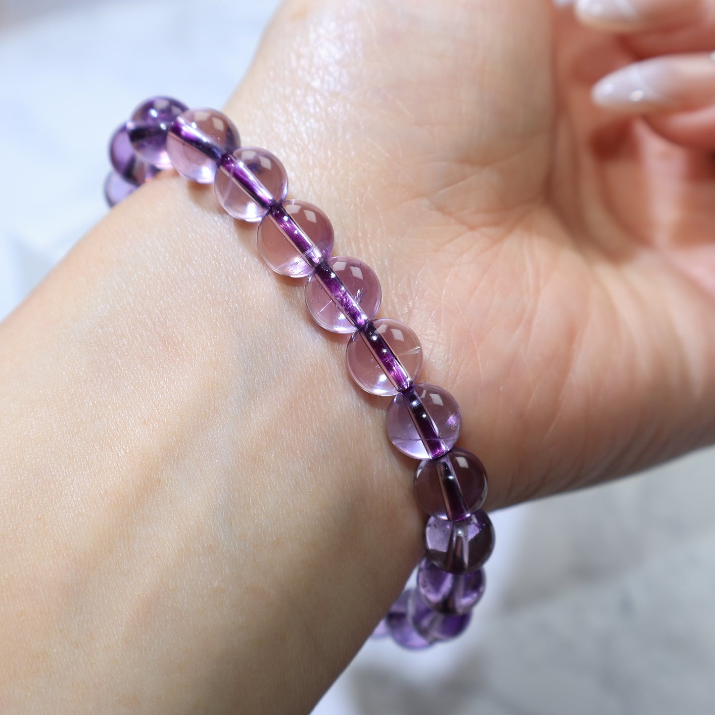 Side angle wrist shot emphasizing the depth and purity of each bead