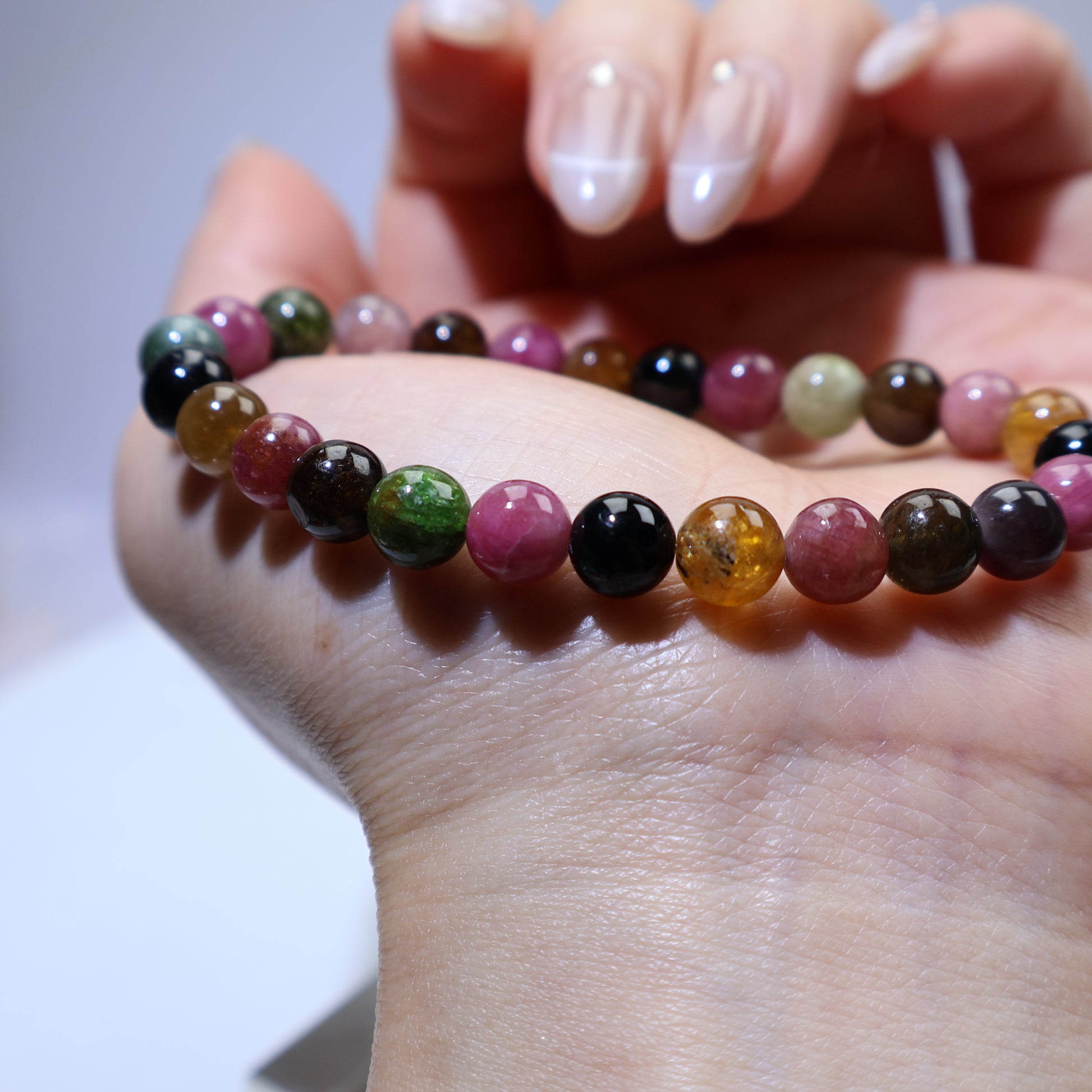 Side wrist view showing smooth round beads and balanced color arrangement