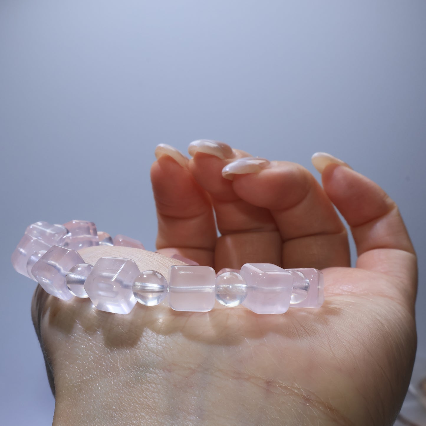 Side wrist shot of Rose Quartz bracelet, emphasizing bead combination and polished finish.