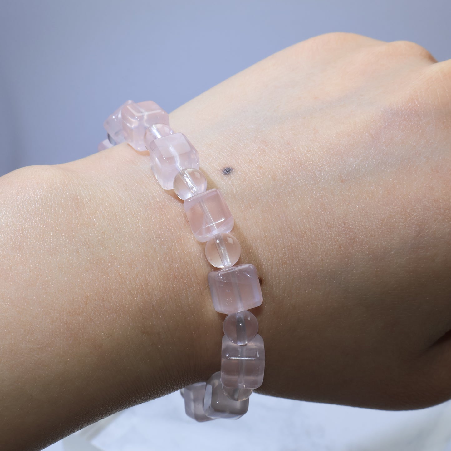 Top wrist view of Rose Quartz bracelet showing snug fit for 15cm wrist size.