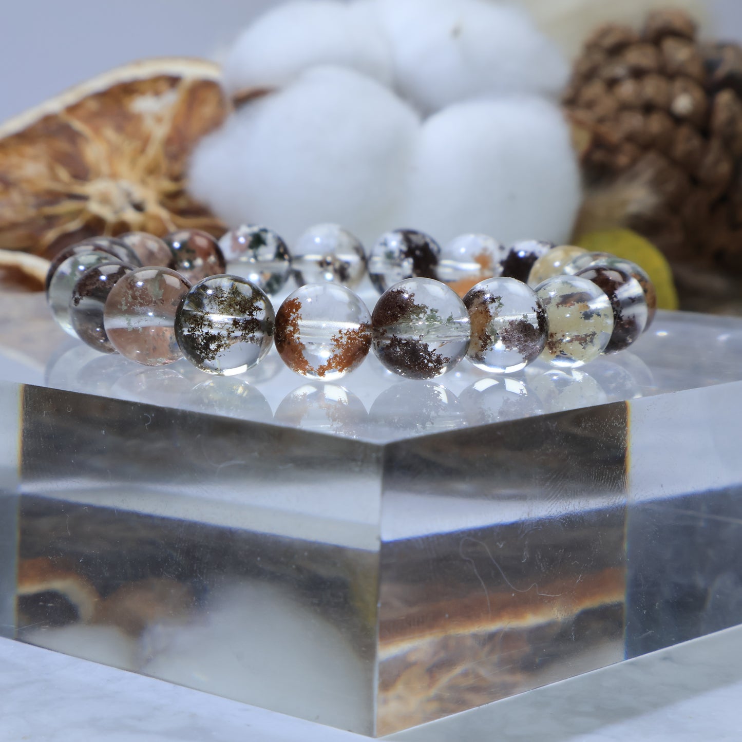 Side angle close-up of Scenic Phantom Quartz beads showing garden-like inclusions