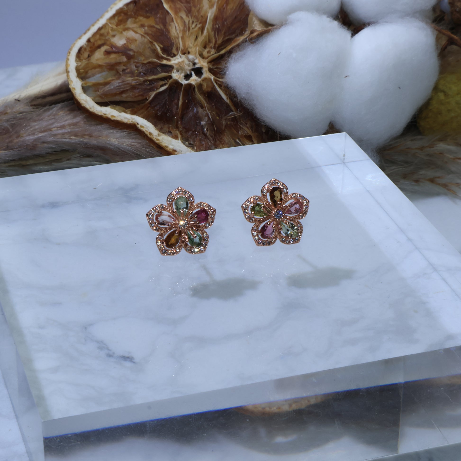 Close-up front view of Verdant Elegance Tourmaline & Zircon Earrings showing vibrant gemstones set in sterling silver