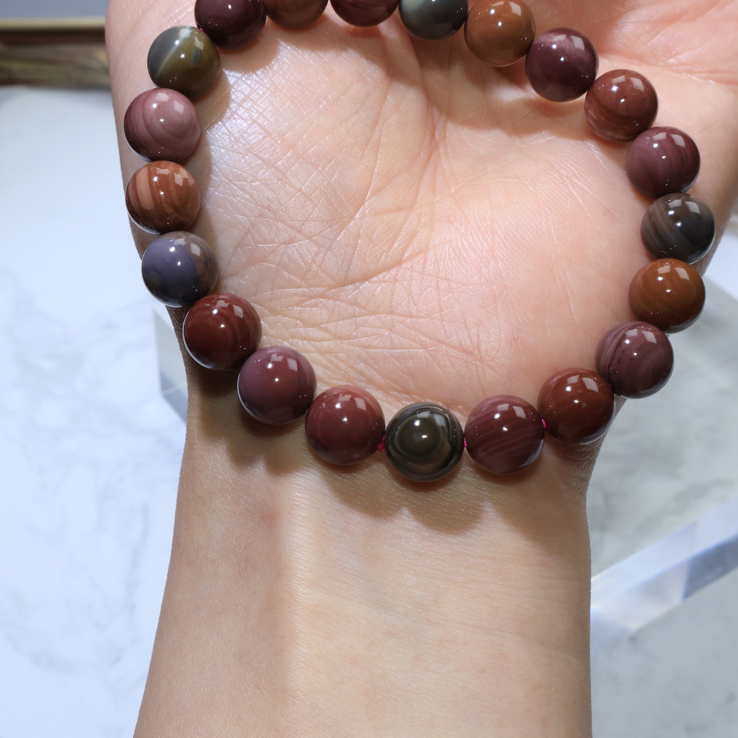 Wrist shot of Alashan Agate bracelet highlighting natural banding