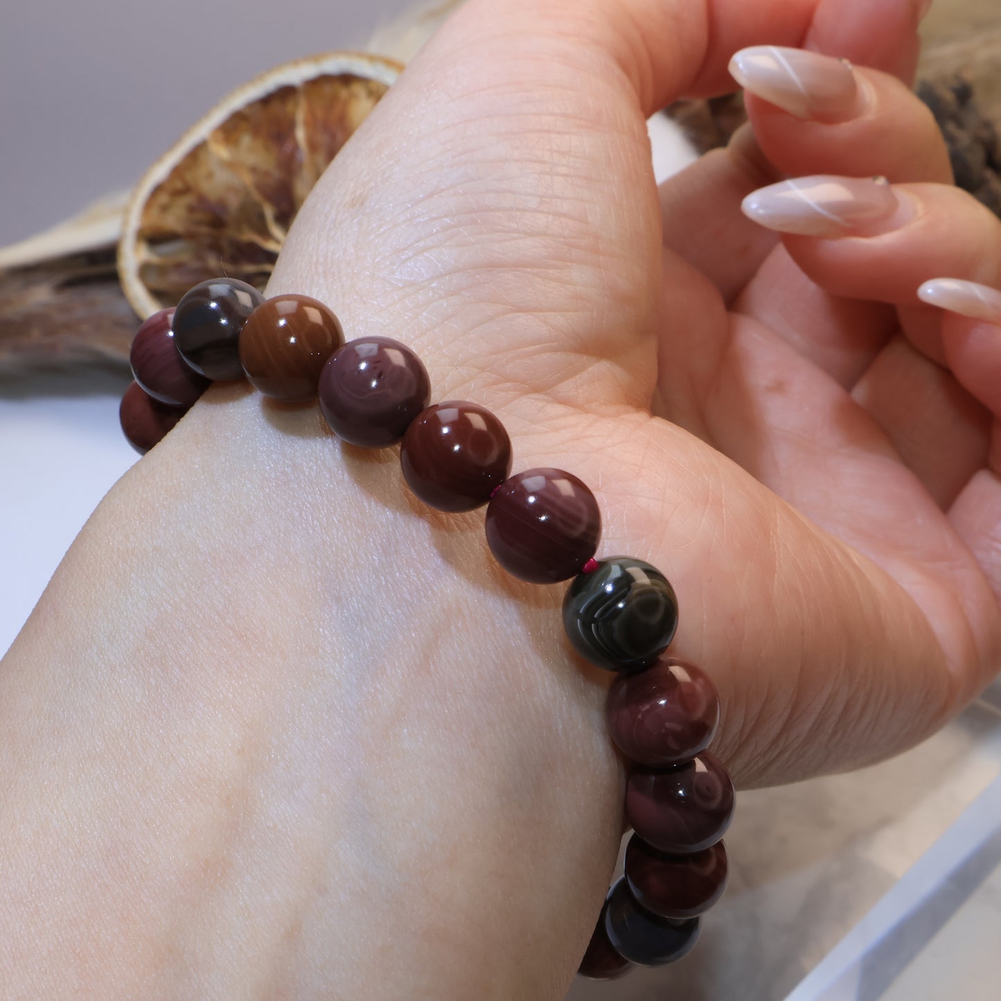 Hand-turned angle showing green and red bead contrast