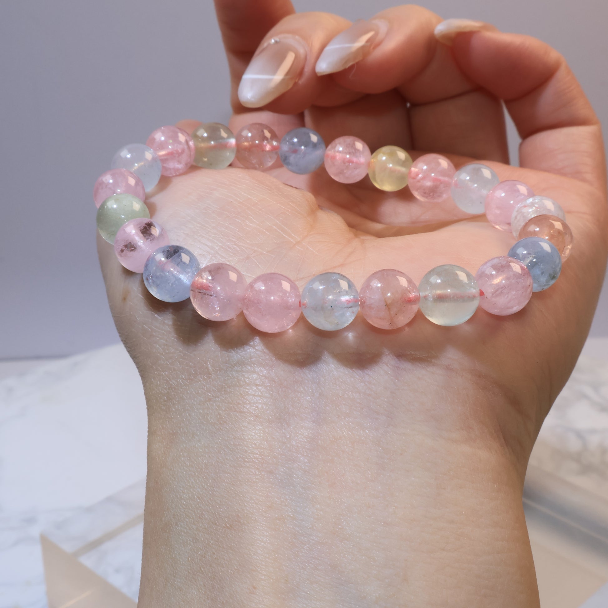 Rainbow Morganite bracelet on wrist with natural light highlighting bead colors