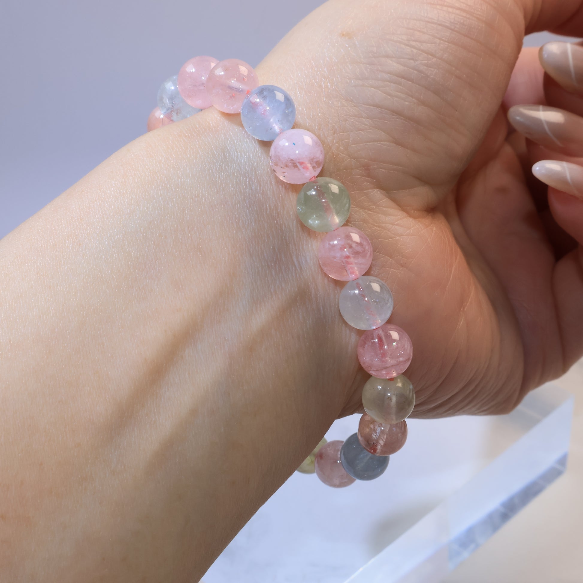 Hand-turned angle showing full Rainbow Morganite bracelet circle