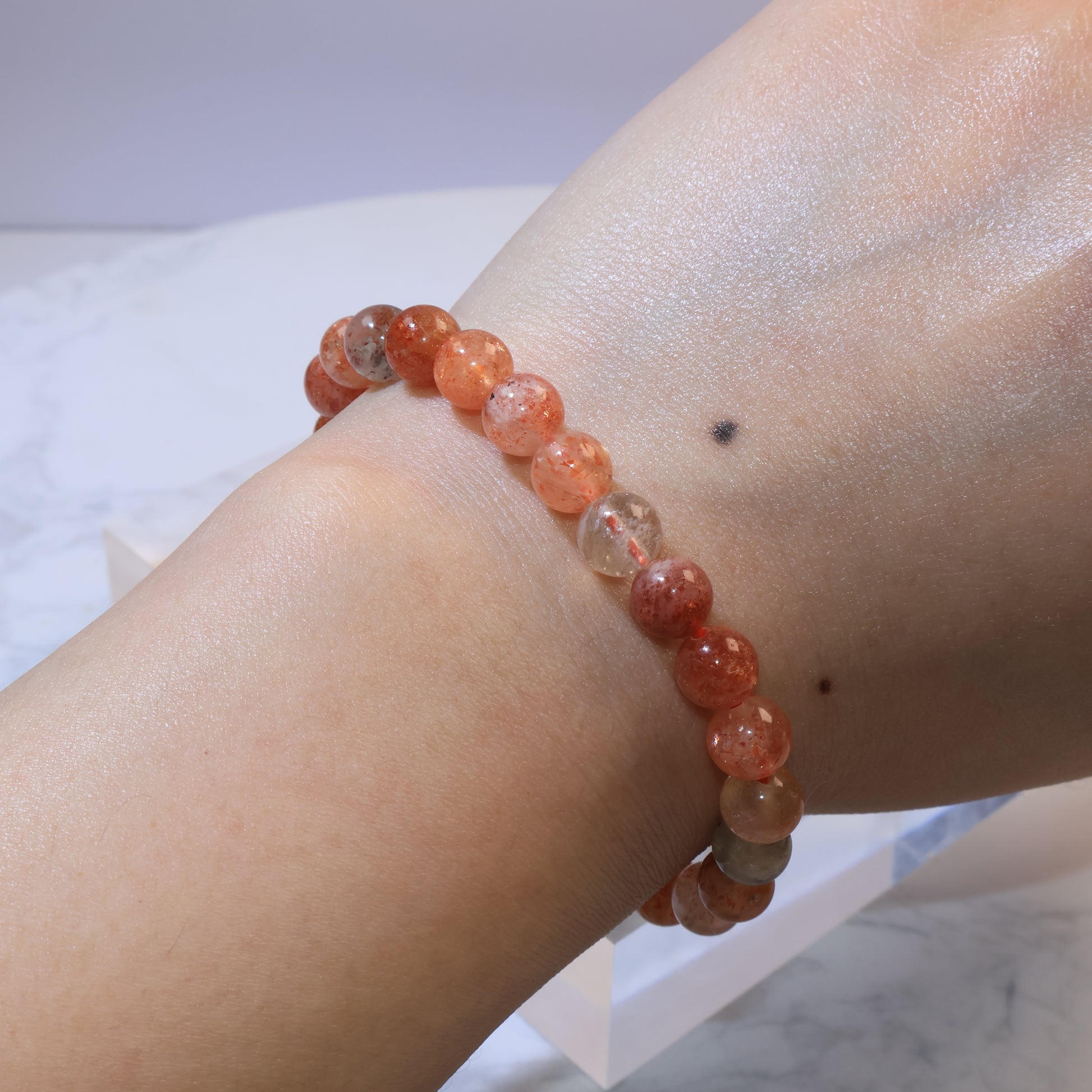 Wrist shot of Arusha Sunstone bracelet with even bead arrangement