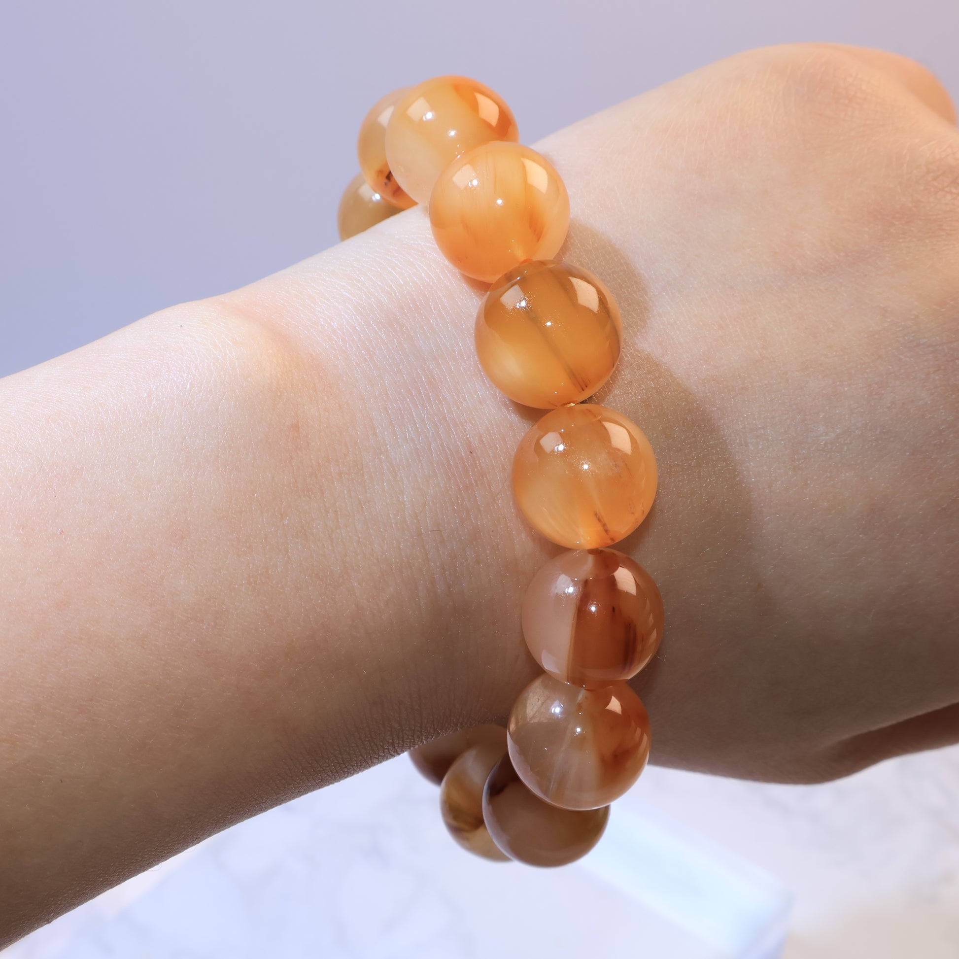 Yellow Rabbit Hair Quartz bracelet worn on wrist in natural light, revealing brown filaments within