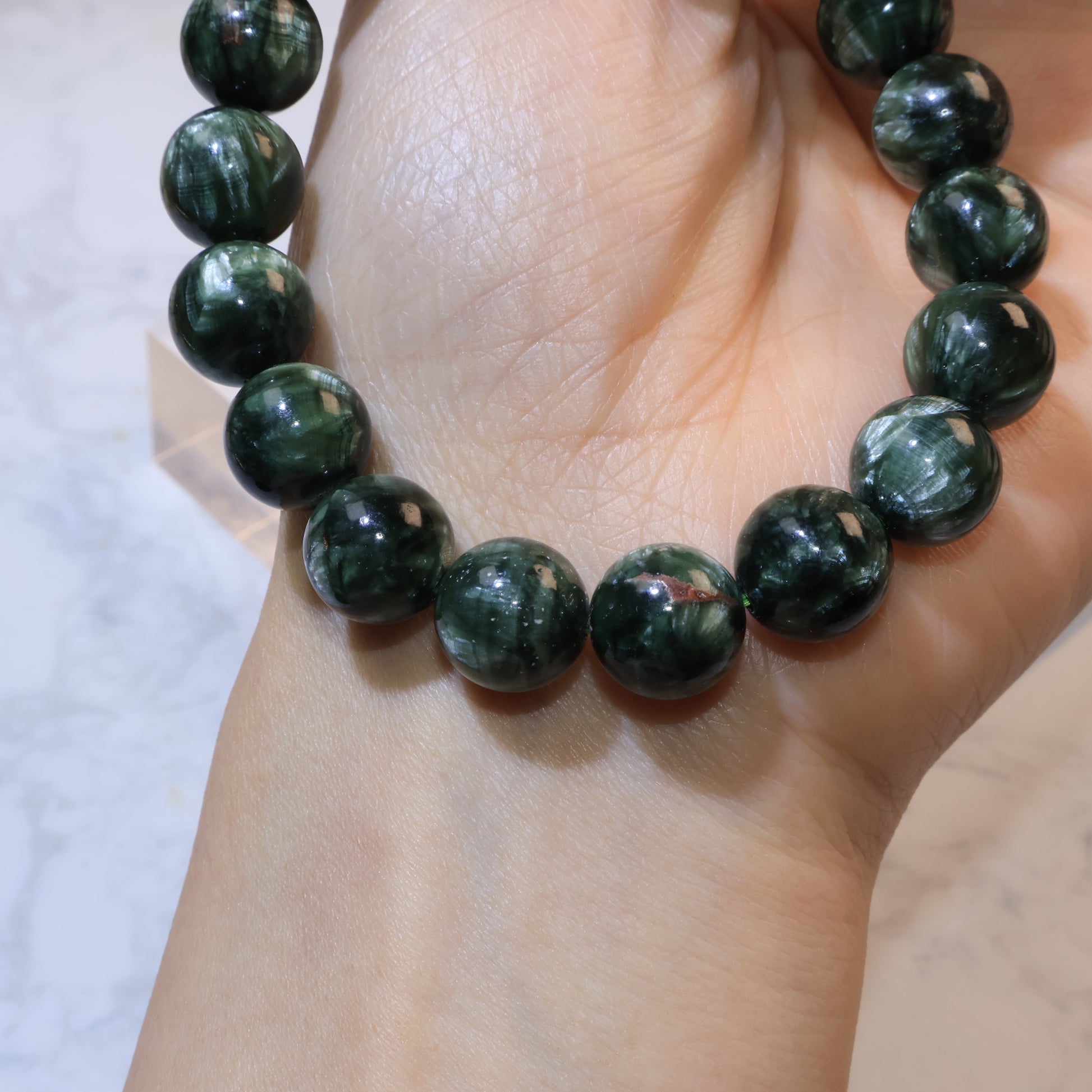 Seraphinite bracelet 11mm Russia – worn on wrist side view
