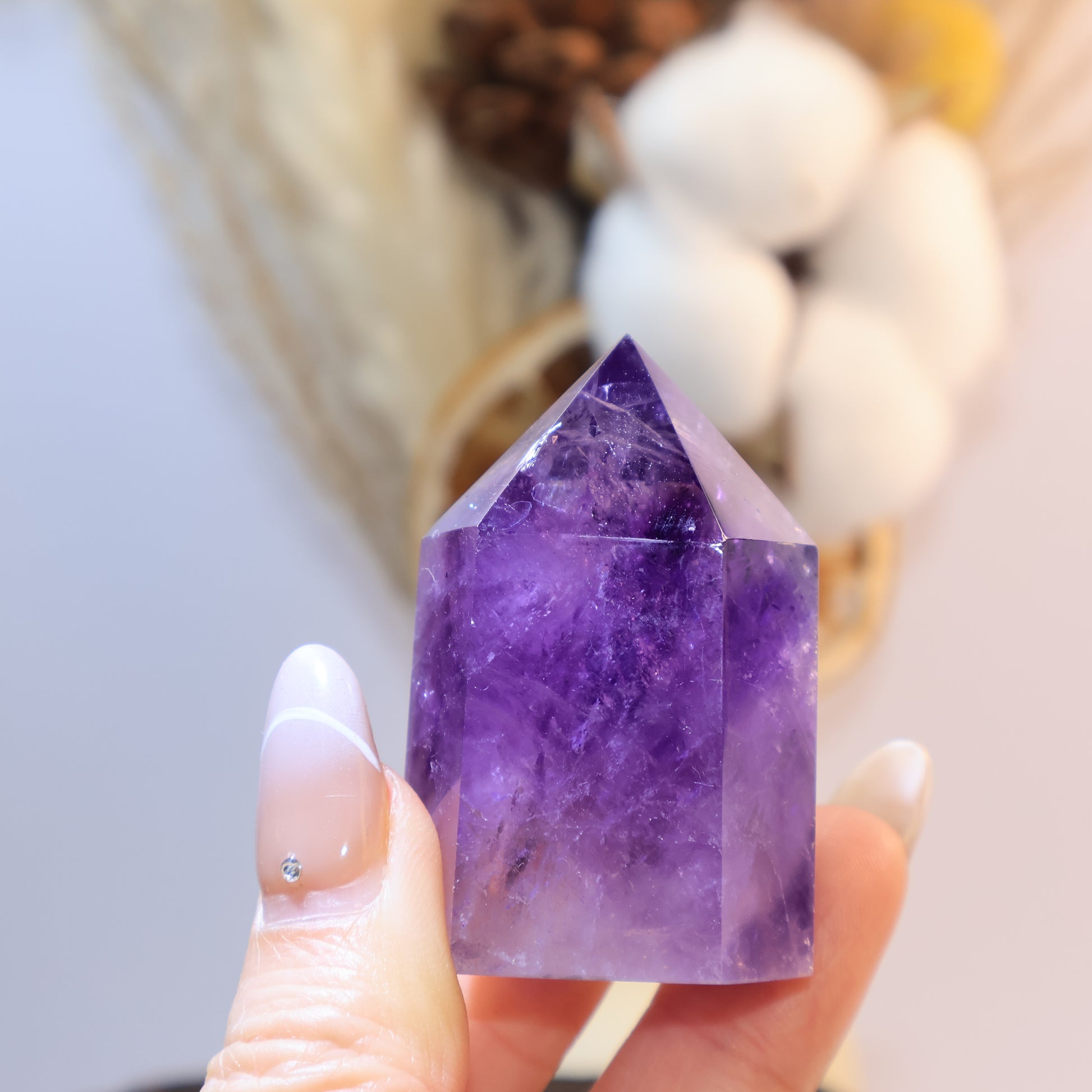 Hand-held view showing size and purple glow under light