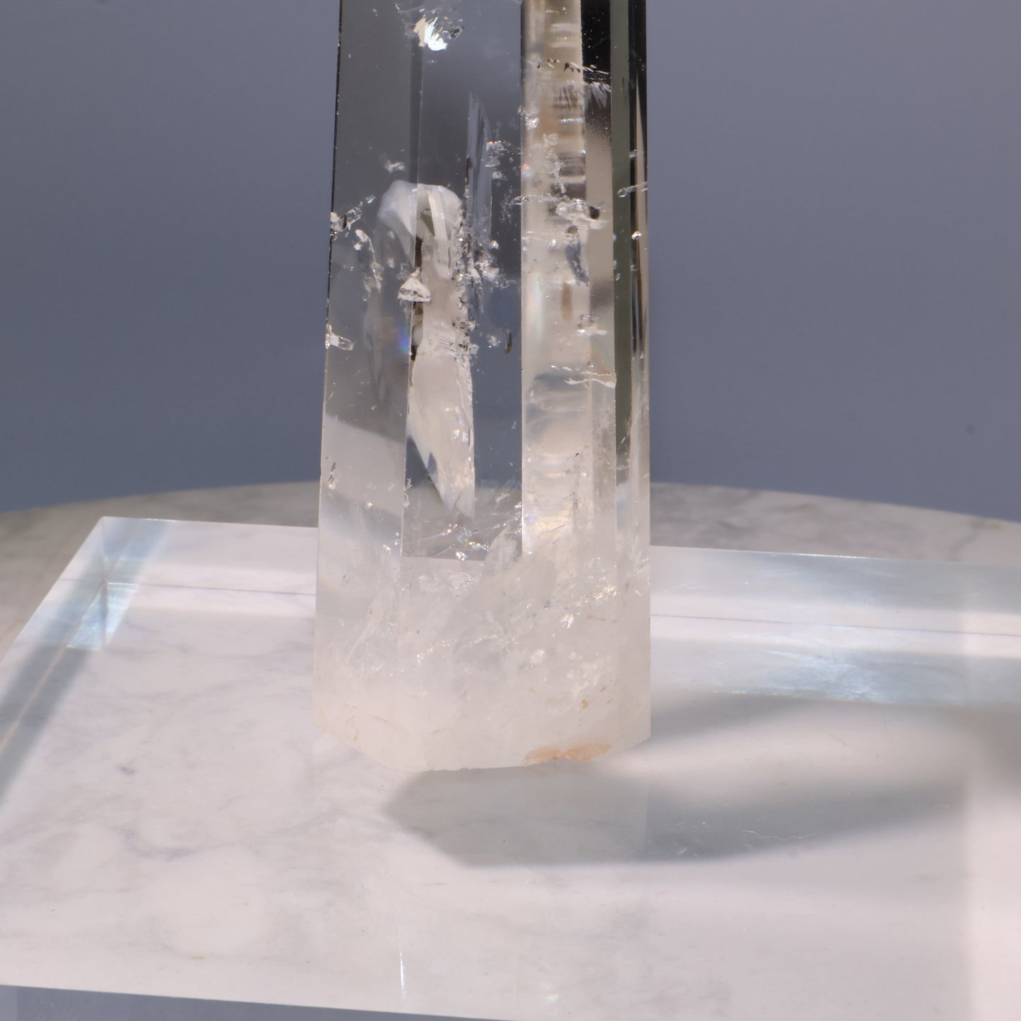 Clear Quartz Tower – bottom view with internal fractures and natural inclusions.