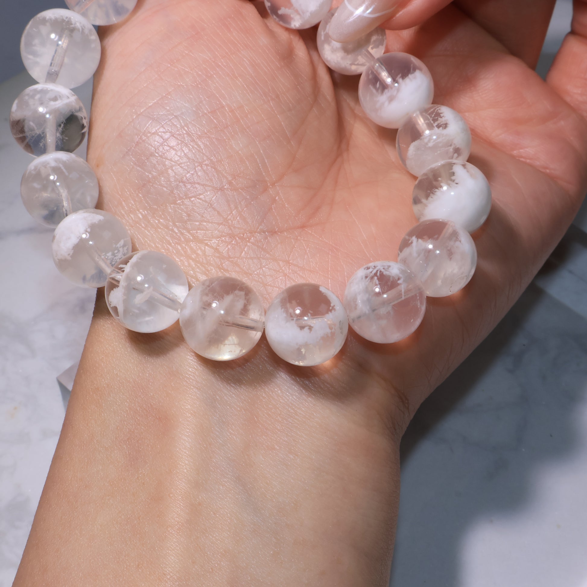 Detailed wrist shot, translucent beads with unique white inclusions.