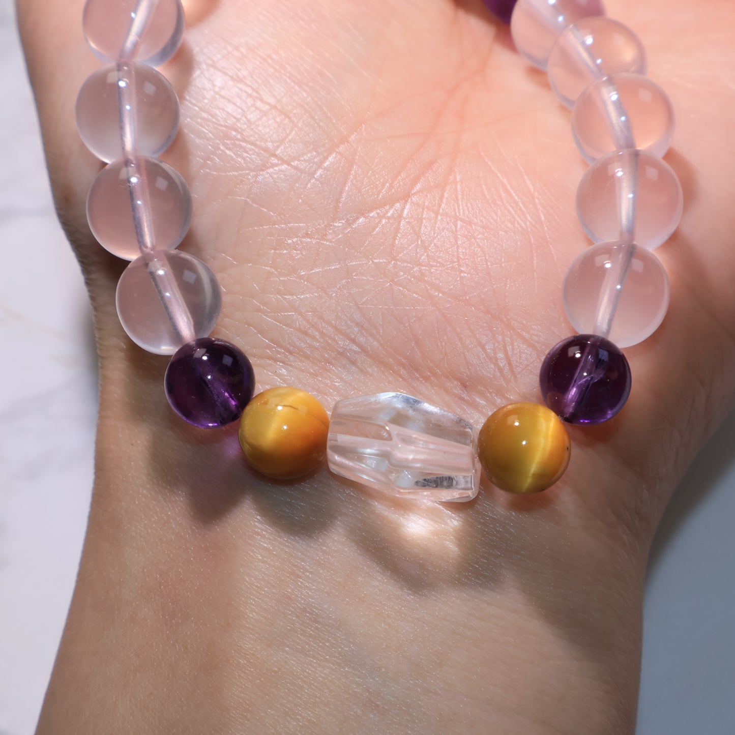 Wrist shot of the bracelet with Clear Quartz centerpiece facing upward.