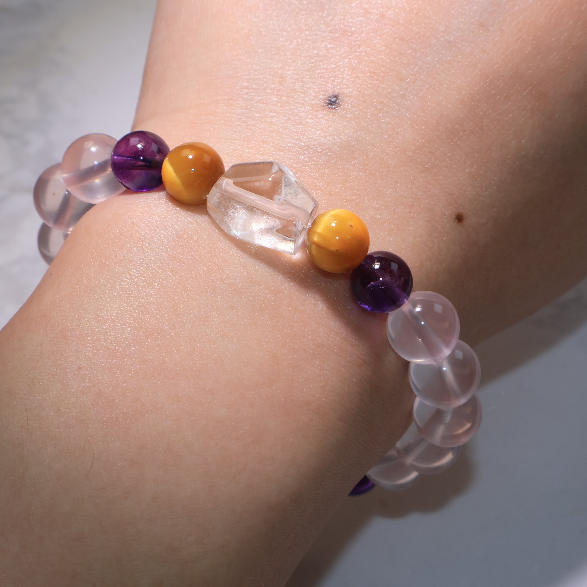 Bracelet worn on wrist, showing harmonious crystal combination in natural light.