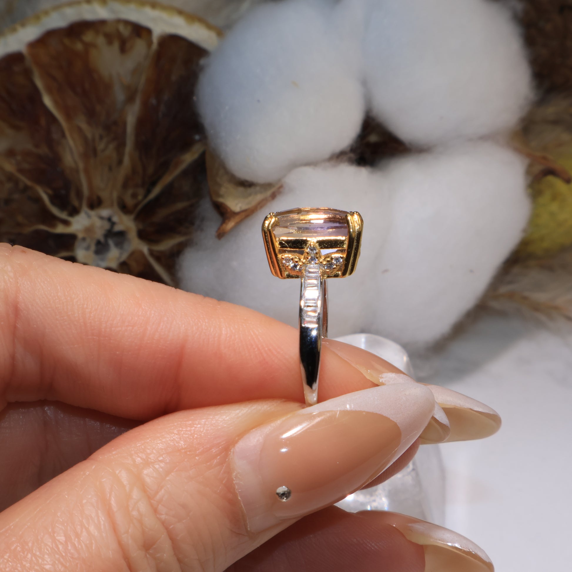 Profile view showing the side structure and silver band inlaid with zircon stones.