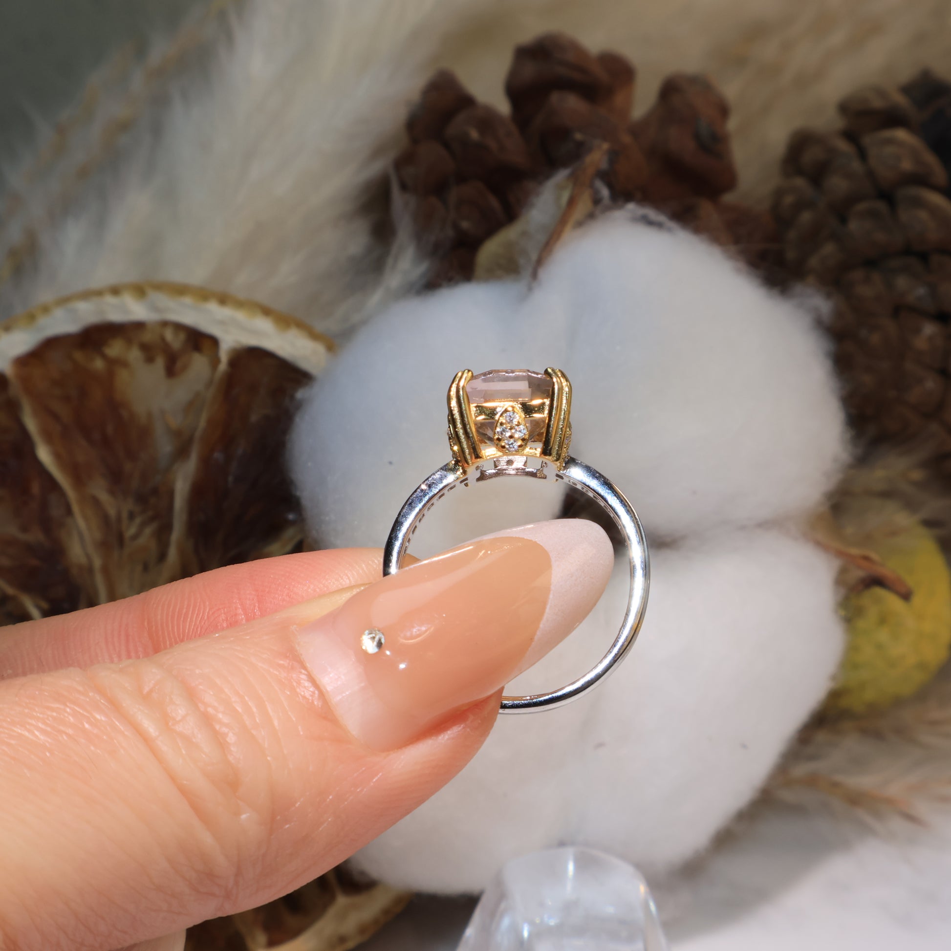 Rear view of the ametrine ring highlighting gold prongs and open back design.