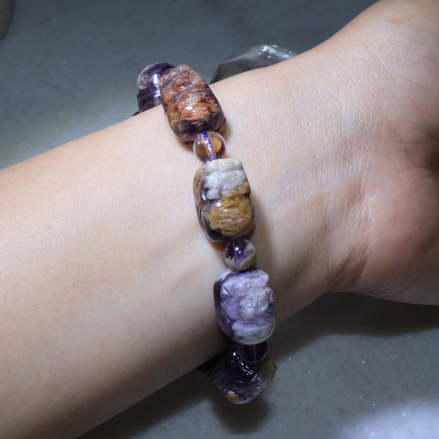 Natural Feng Shui Pixiu crystal bracelet featuring translucent purple spacer beads