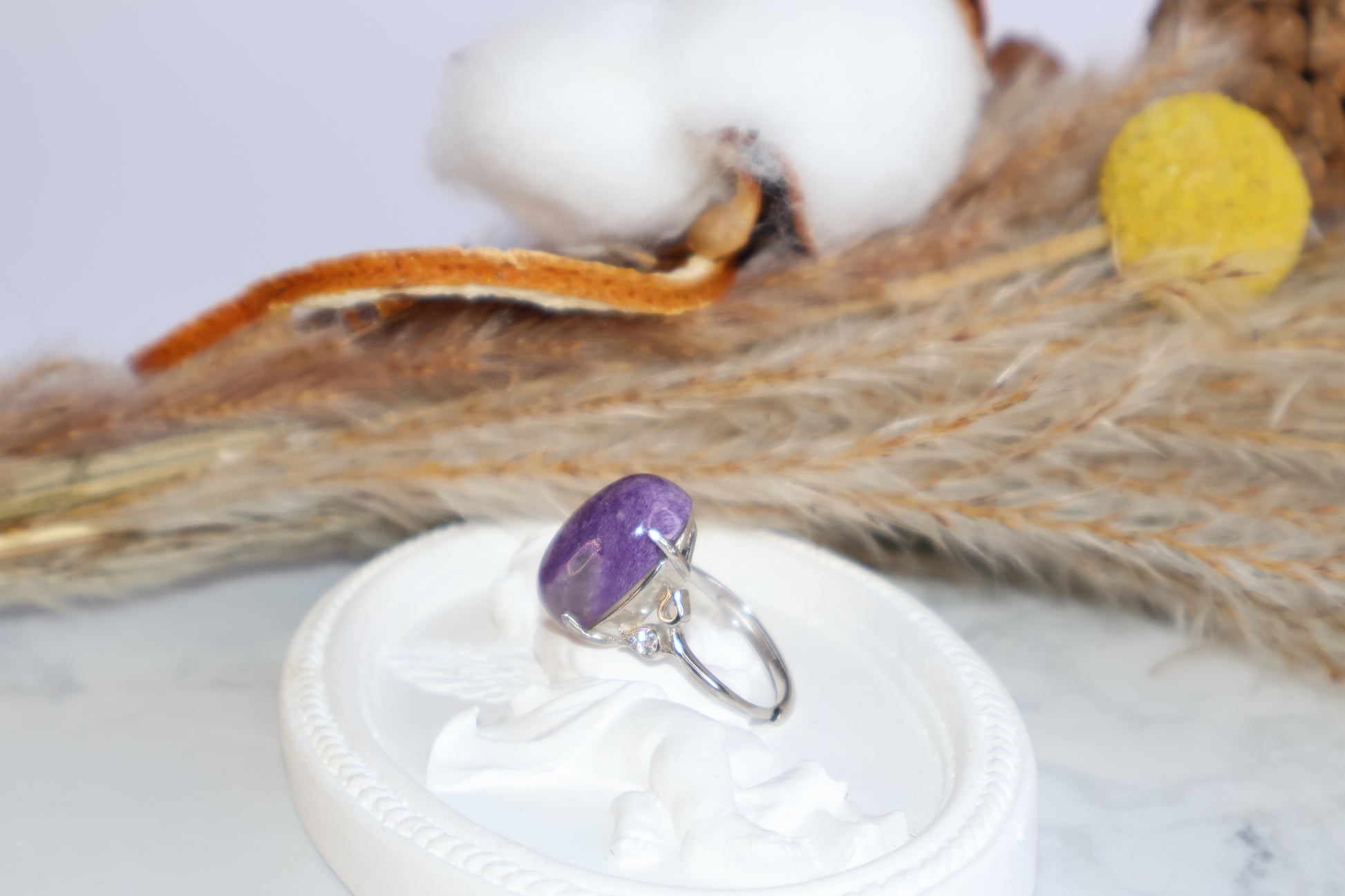 Side profile of 13×18mm charoite ring with sparkling cubic zirconia accents