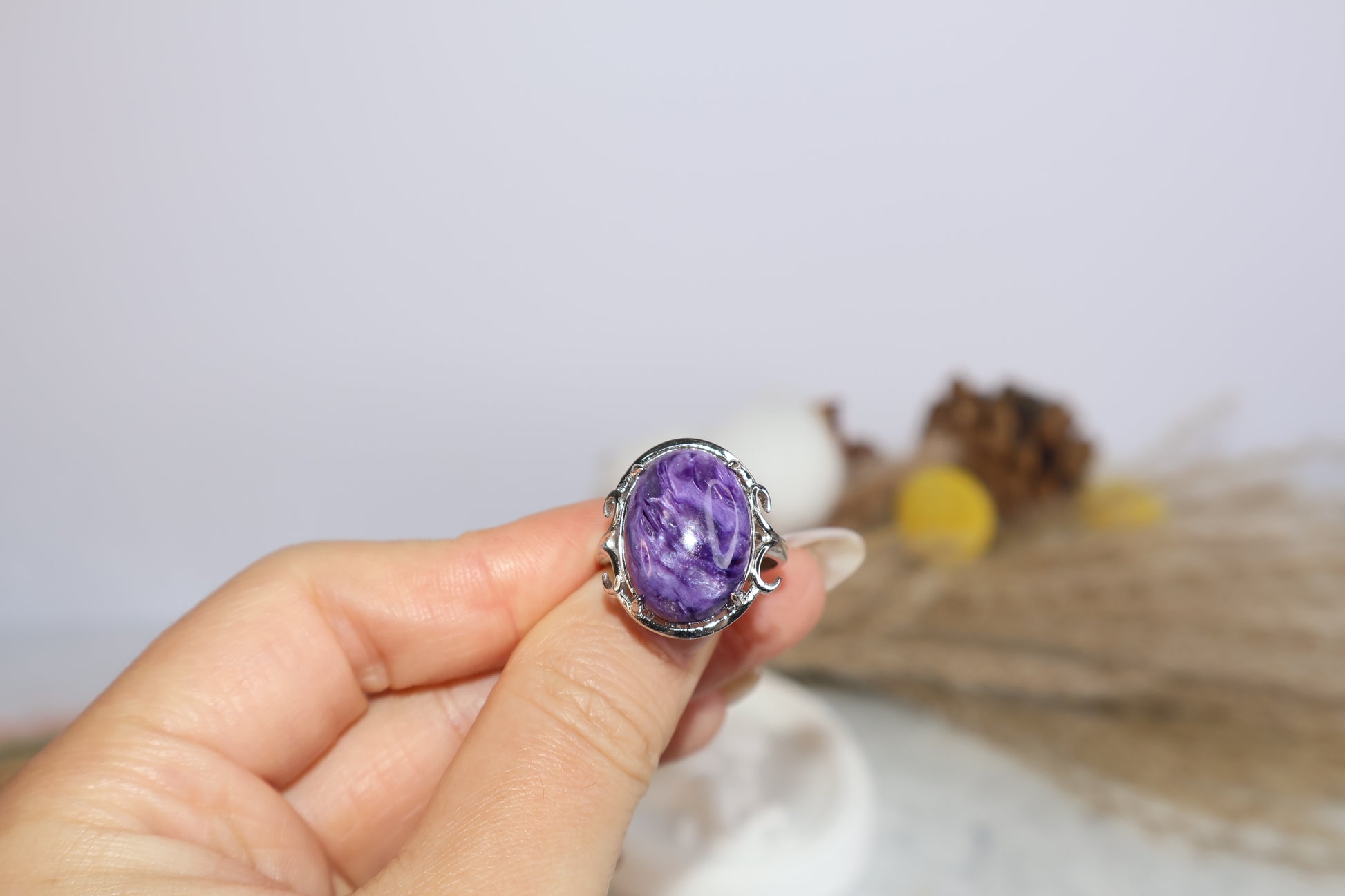 Close-up of 13×18mm purple charoite gemstone ring in claw setting