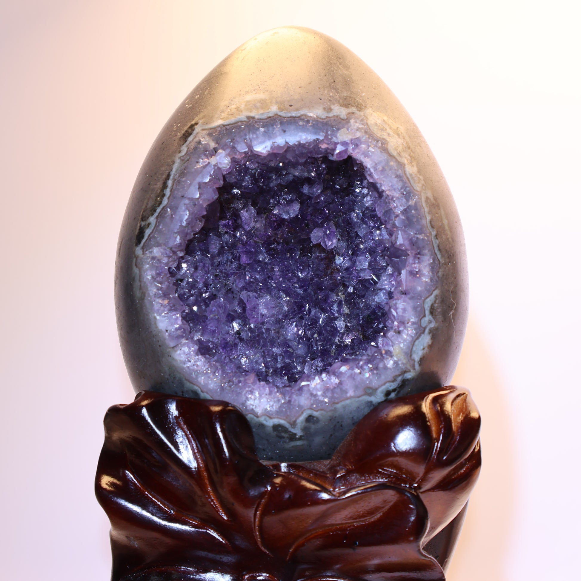 Close-up of deep purple crystal formation inside the geode