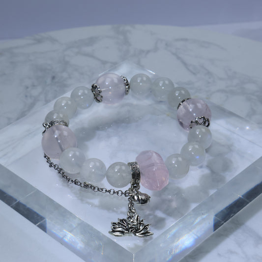 Flat lay of Mystic Key original bracelet with 福 peach charm