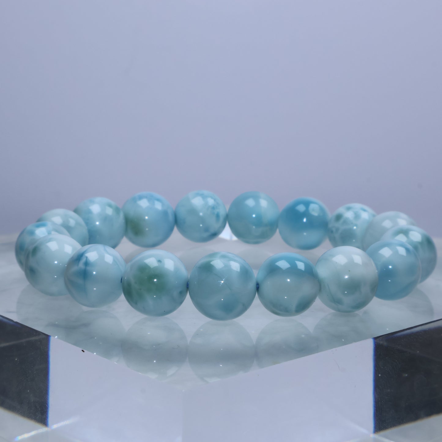 Natural side lighting highlighting Larimar’s flowing patterns and gradients