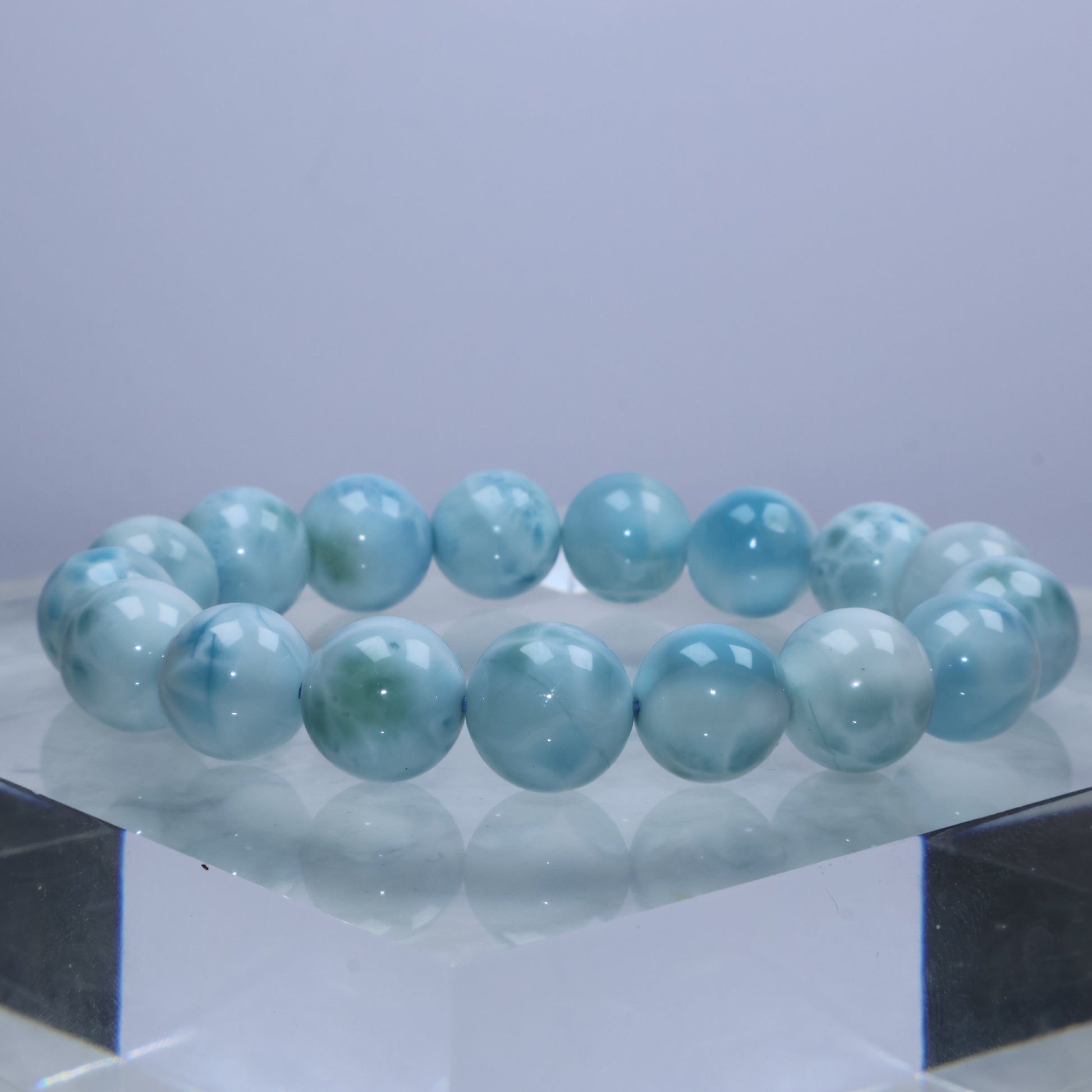 Natural side lighting highlighting Larimar’s flowing patterns and gradients