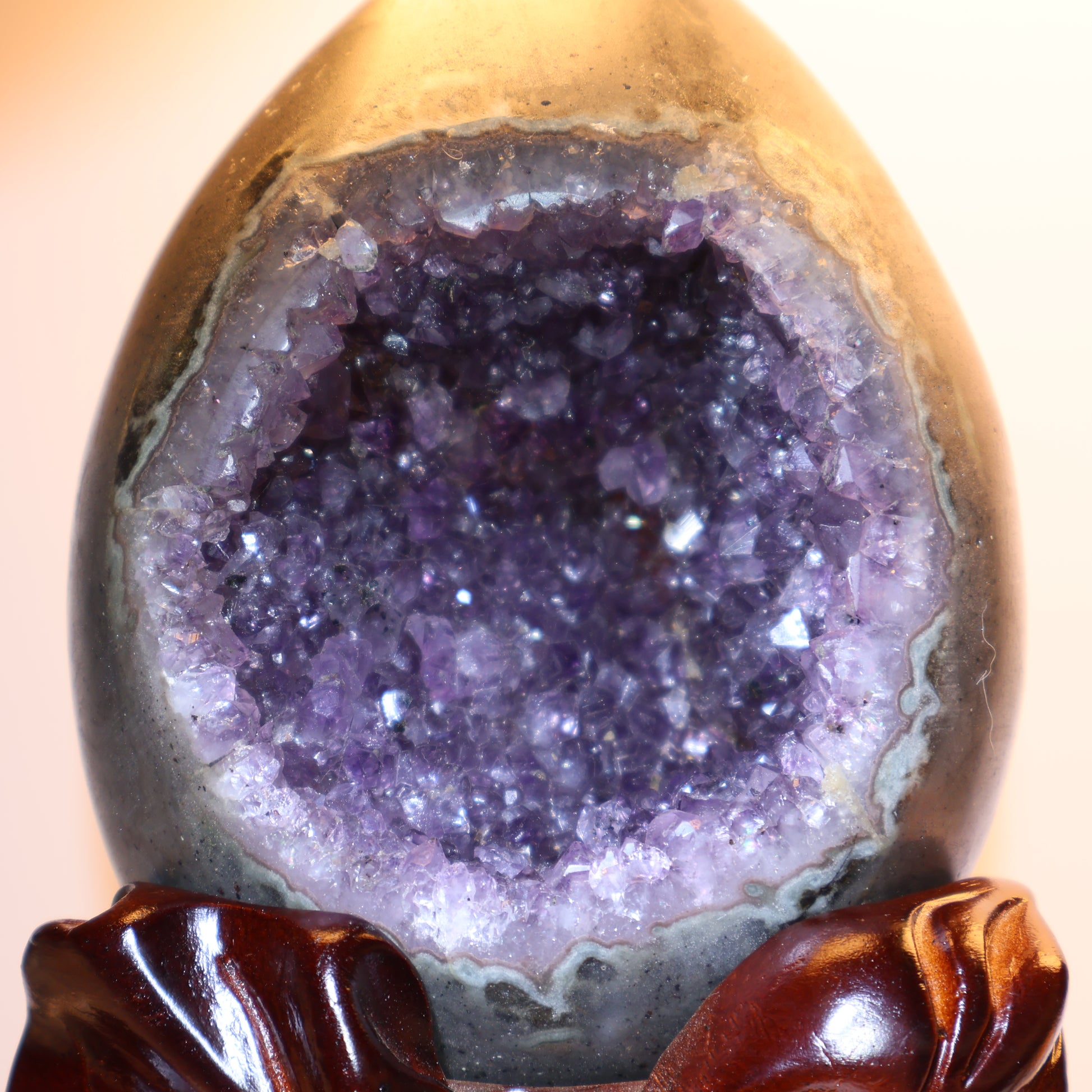 Close-up of deep purple crystal formation inside the geode