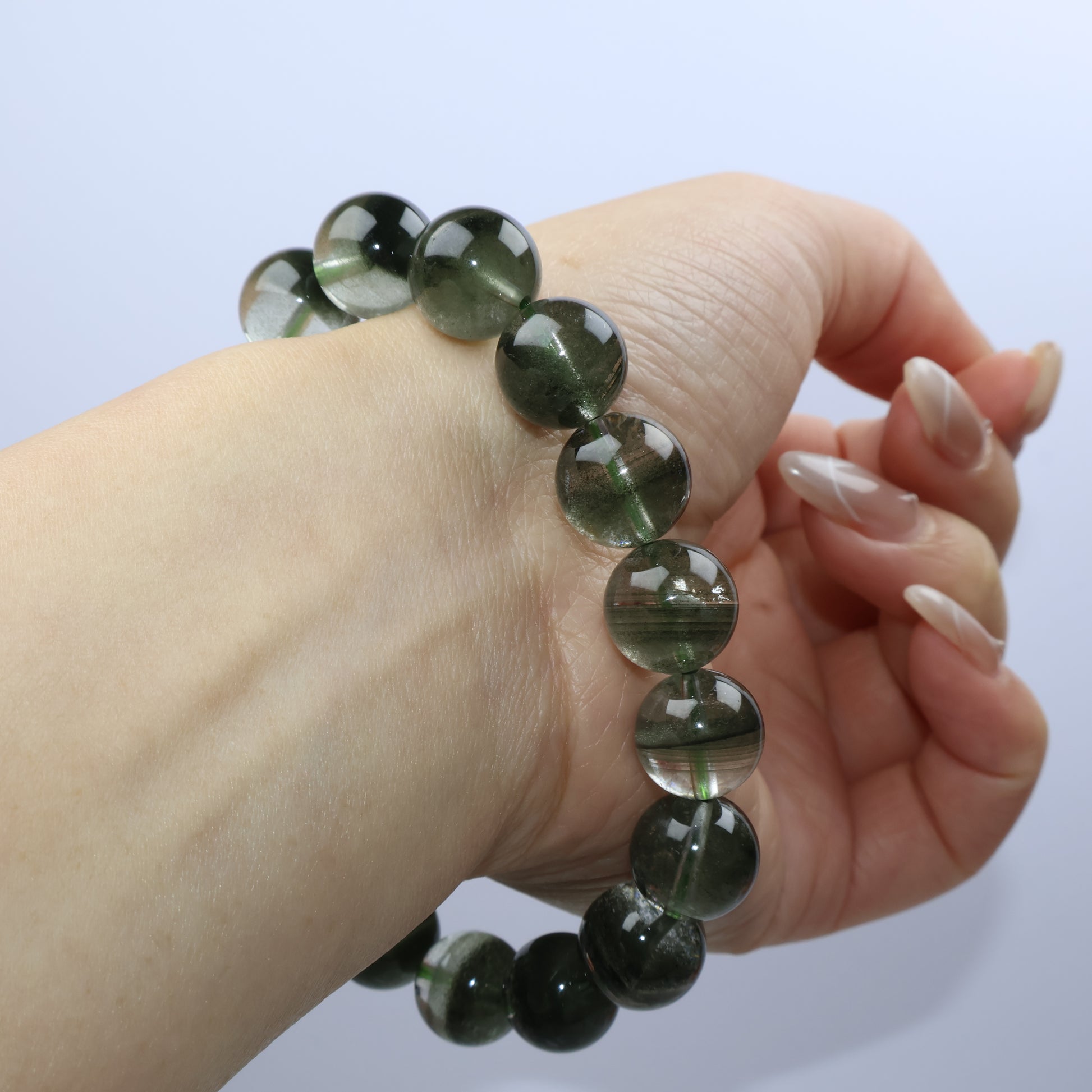 Angle shot of the bracelet curving along the wrist, revealing full crystal polish