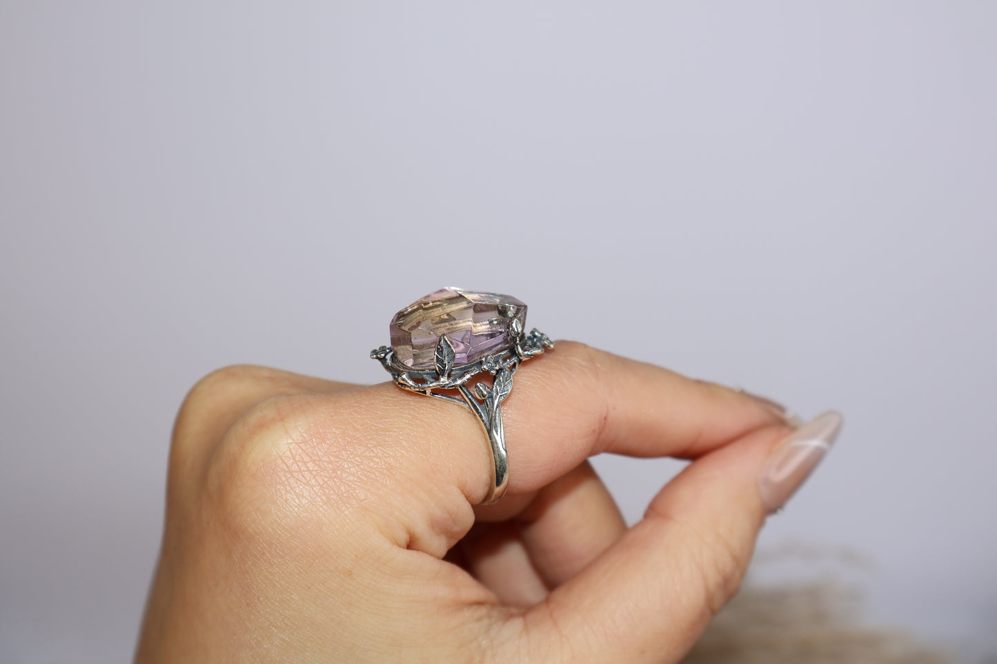 Angled profile of the adjustable S925 ring worn on finger