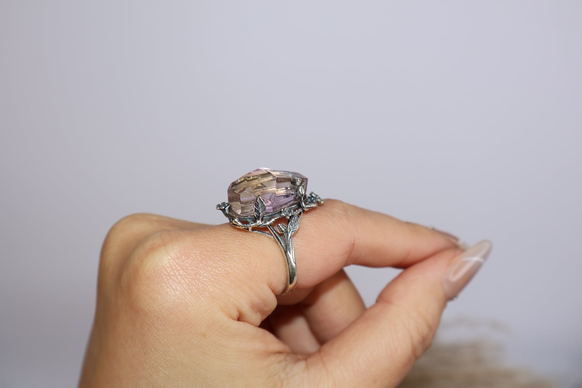 Angled profile of the adjustable S925 ring worn on finger