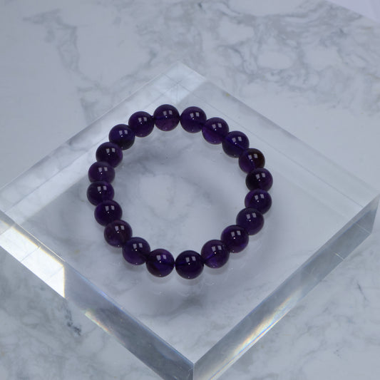 Top-down view of Amethyst bracelet showcasing uniform dark purple tone