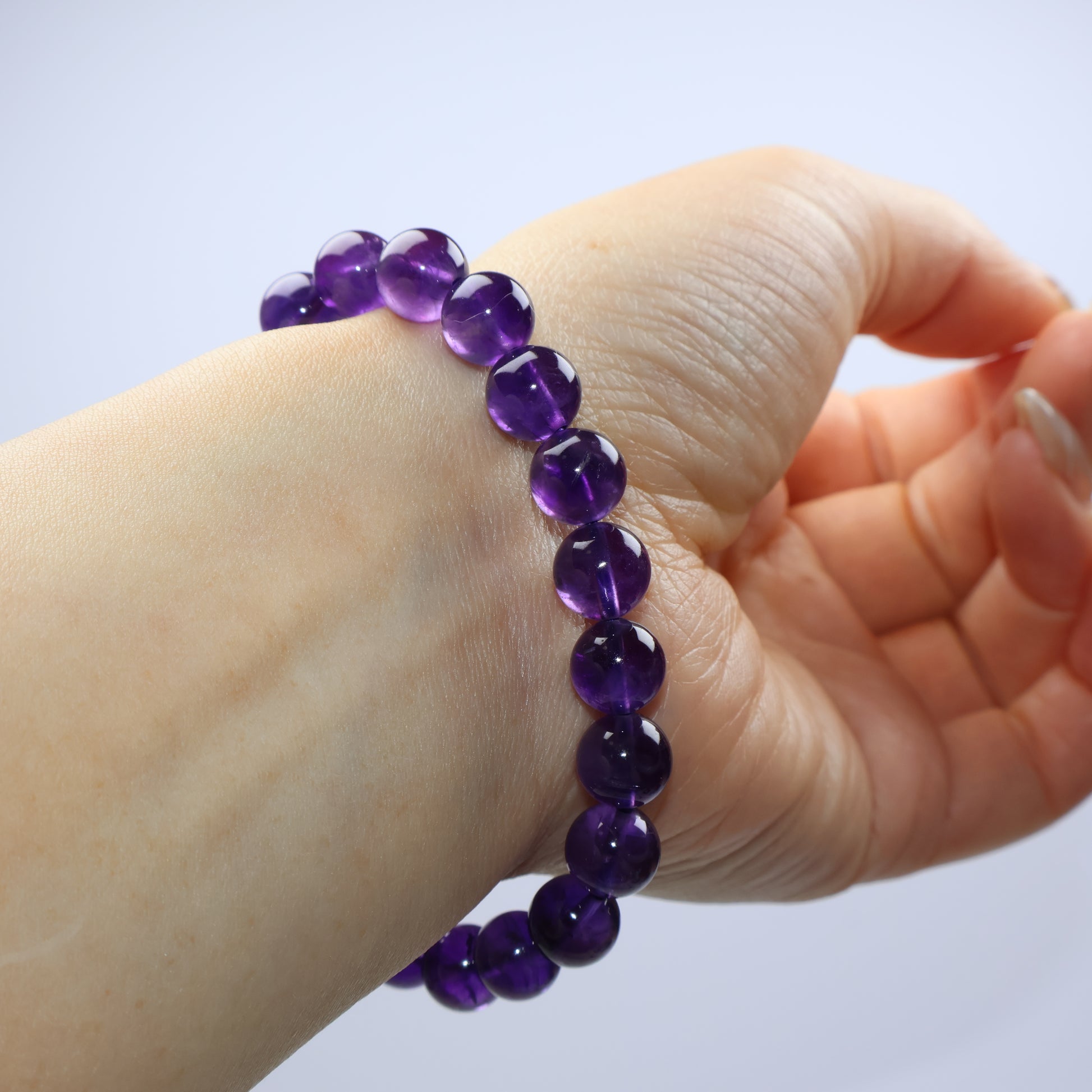 Side-lit view revealing deep saturation and transparency of each bead