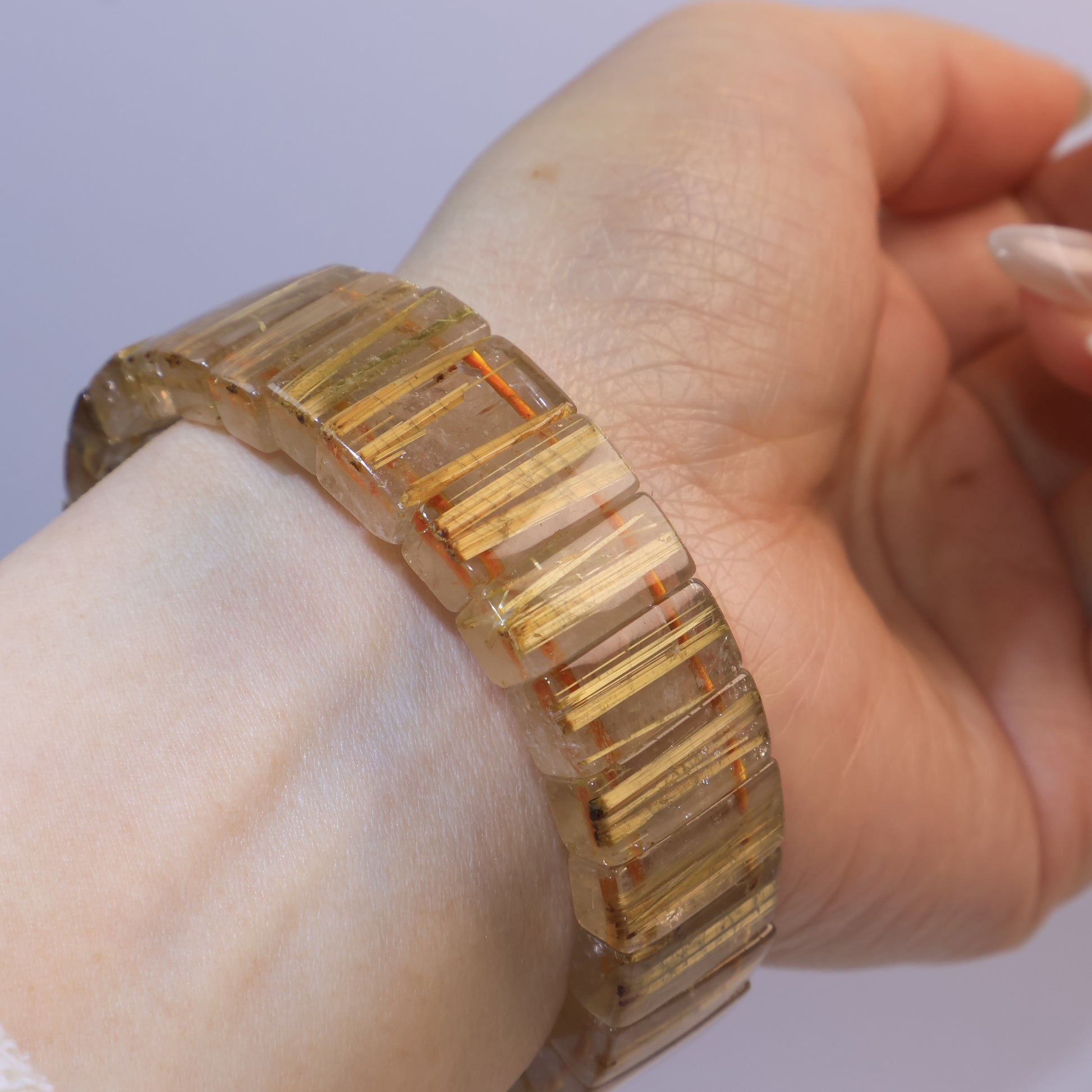 Golden Rutilated Quartz bracelet highlighting natural rutile inclusions.