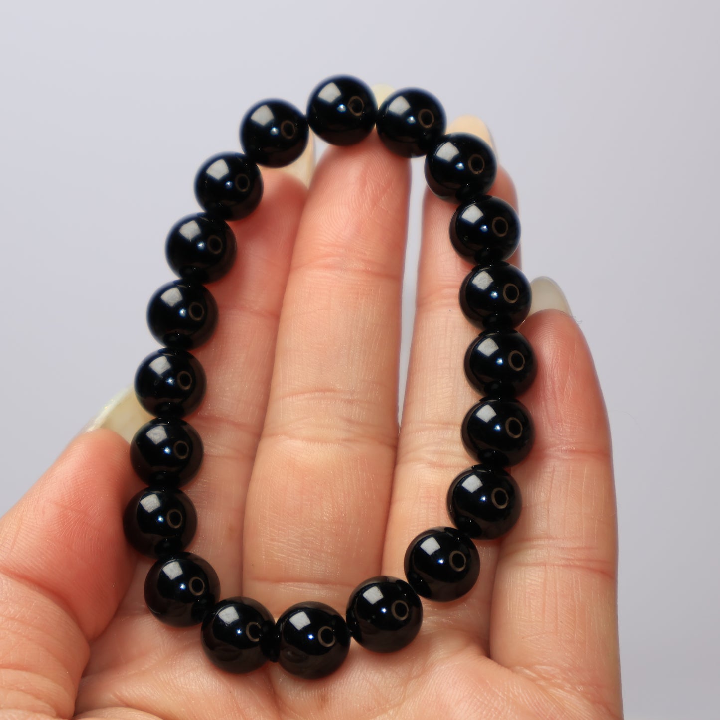 9mm Black Tourmaline Crystal Bracelet in Hand