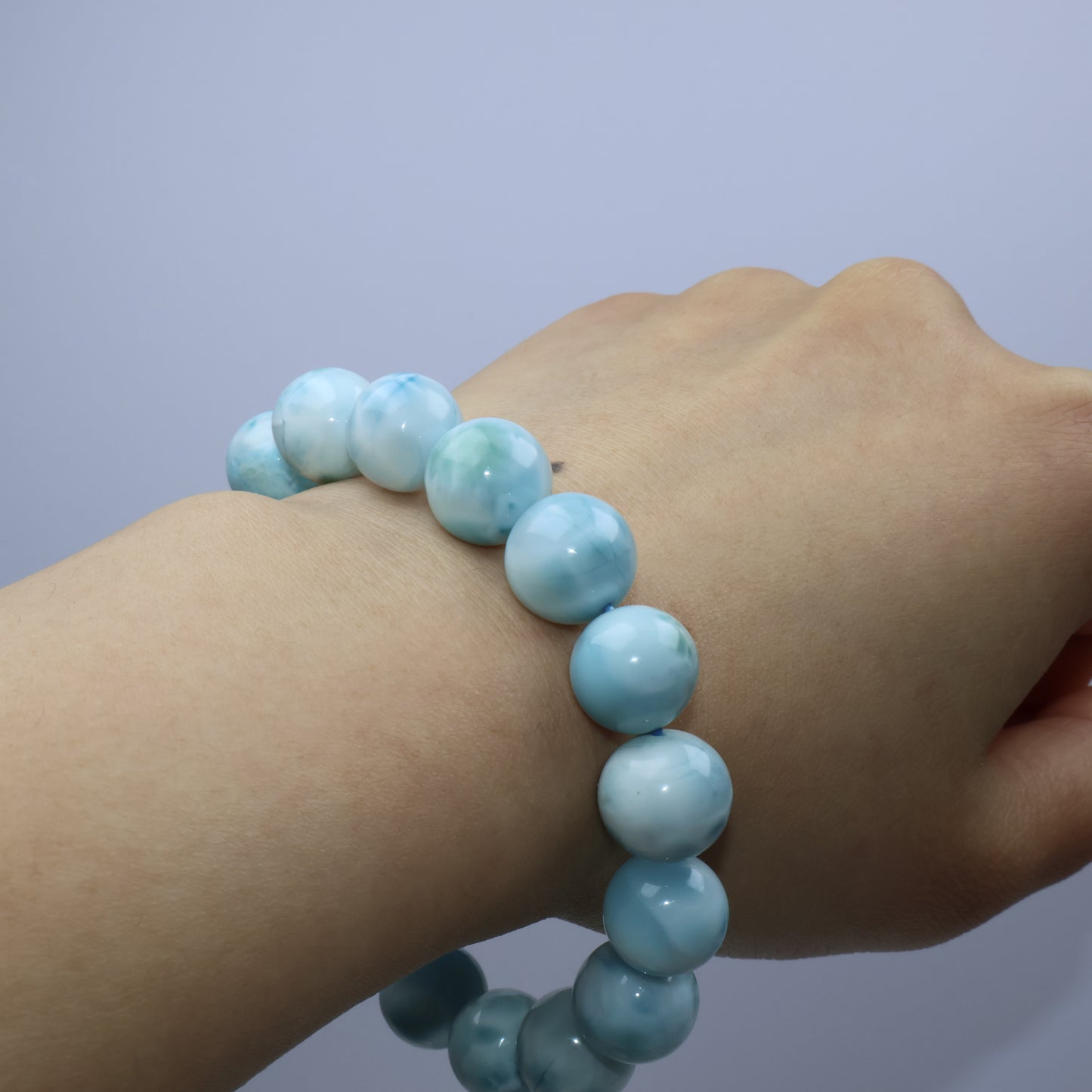 Worn on wrist – Larimar bracelet showing natural blue glow against skin