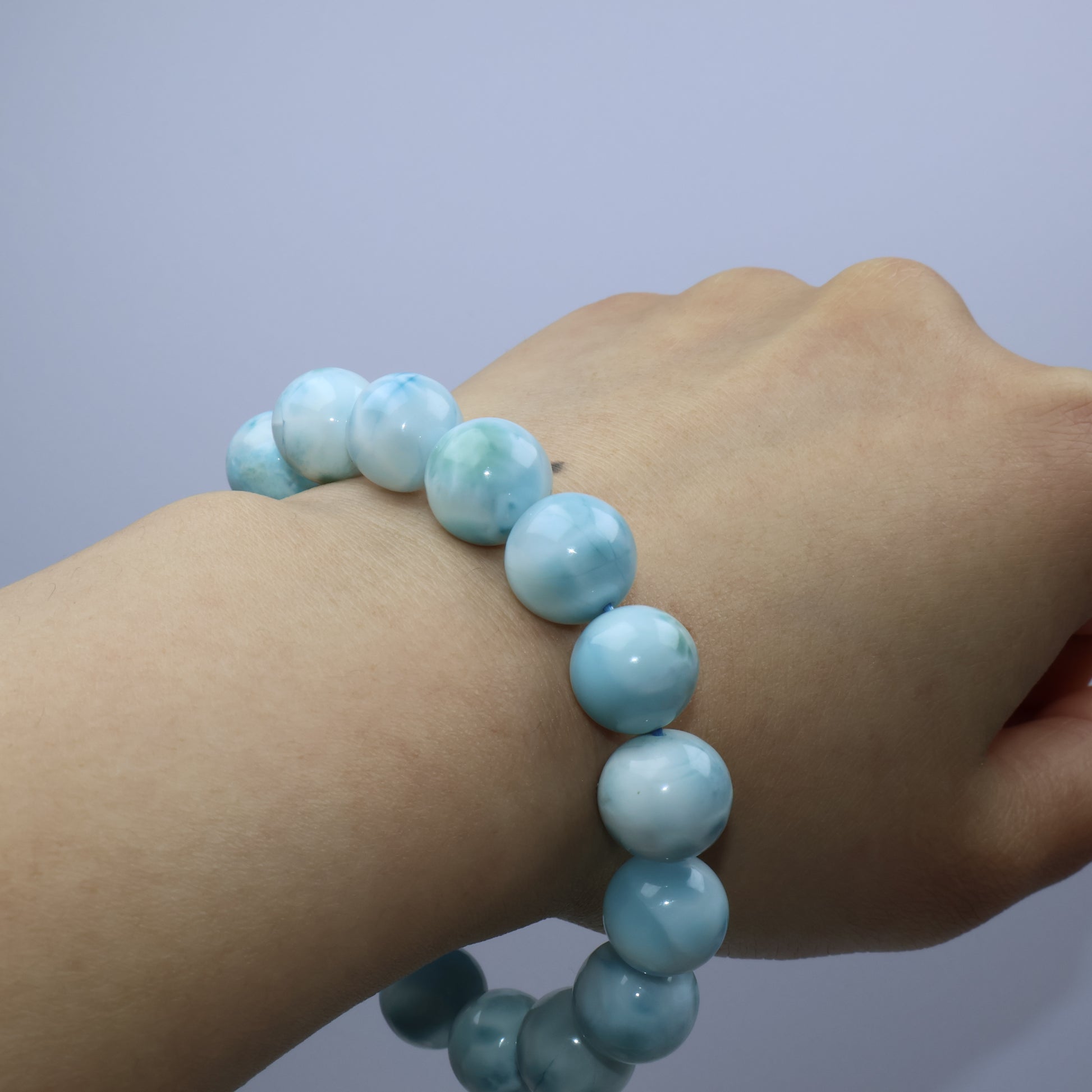 Worn on wrist – Larimar bracelet showing natural blue glow against skin