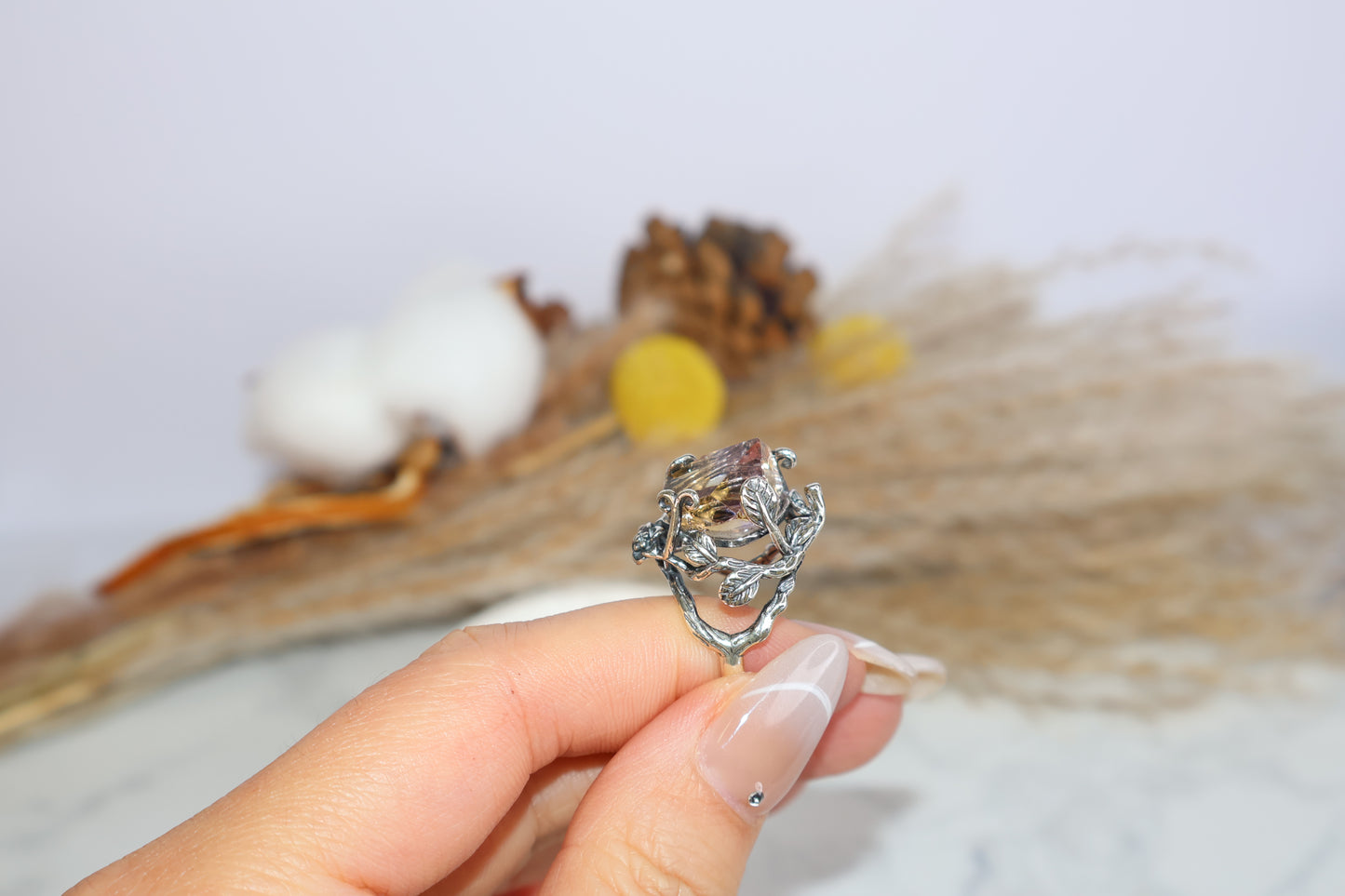 Side profile of Ametrine ring with leaf and vine silver details