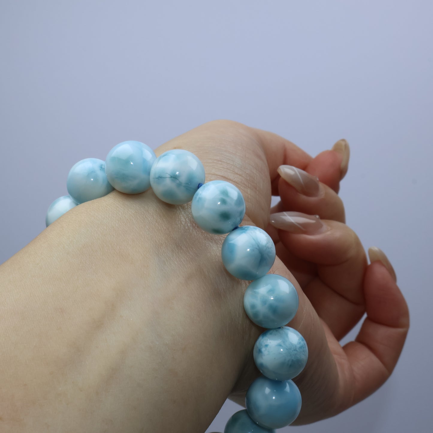 Side view of Larimar bracelet wrapped on wrist with gentle curve