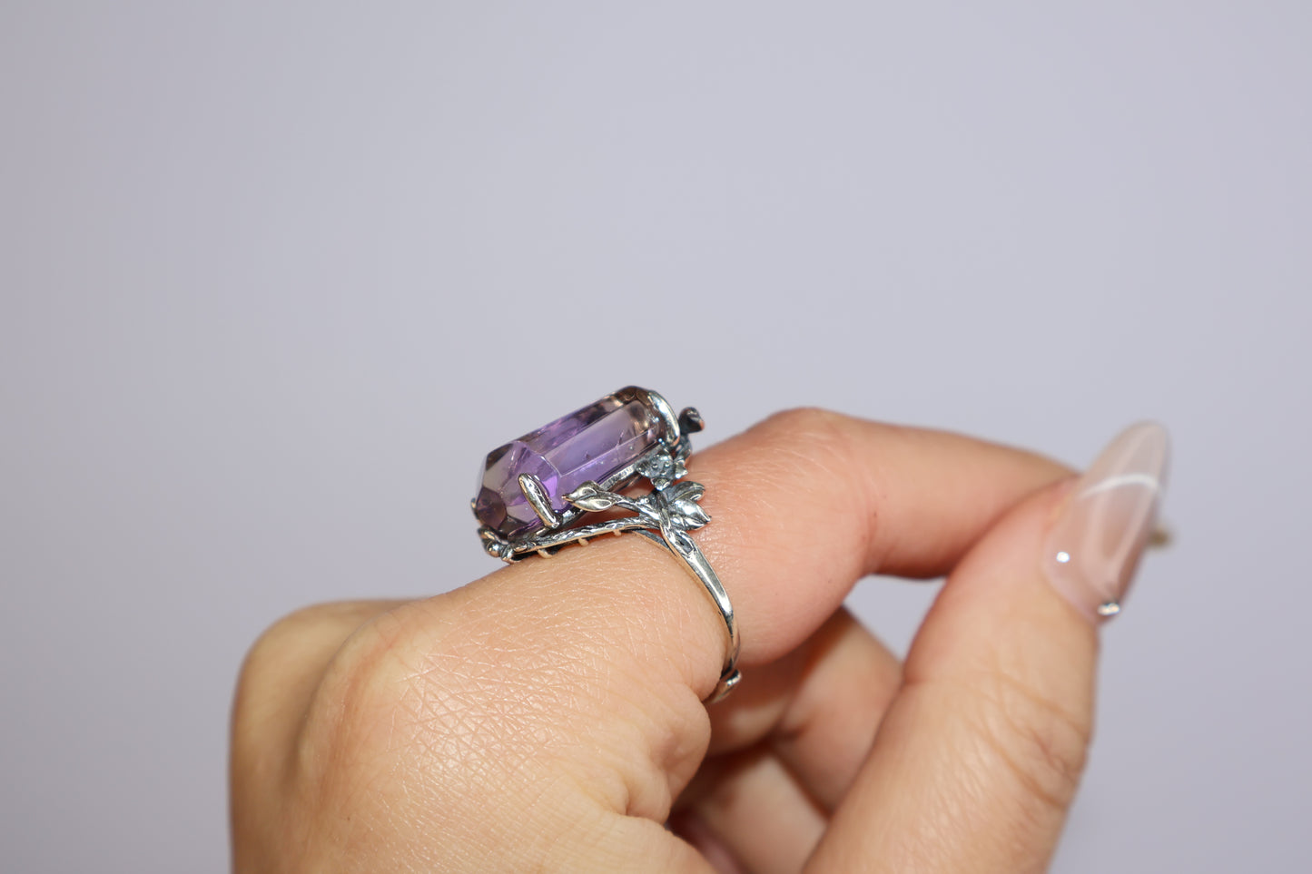 Side view of Ametrine ring with vintage floral vine silver setting on hand