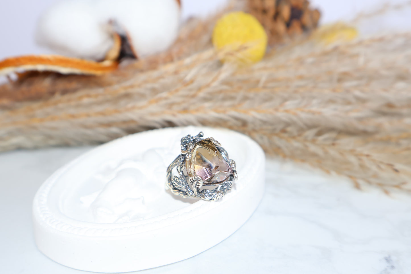 Side profile of Ametrine ring with leaf and vine silver details