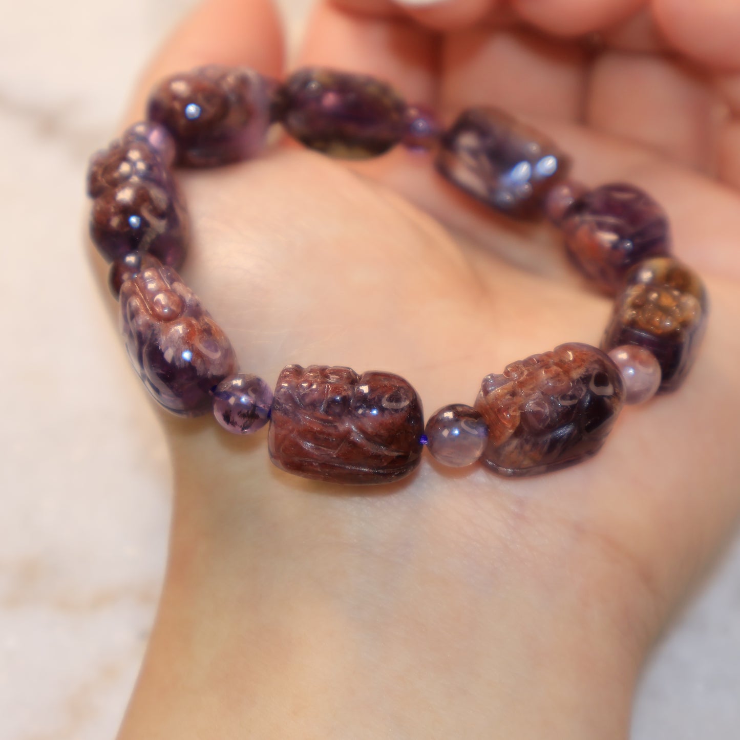 Natural Feng Shui Pixiu bracelet featuring mixed purple, smoky, and earthy crystal patterns