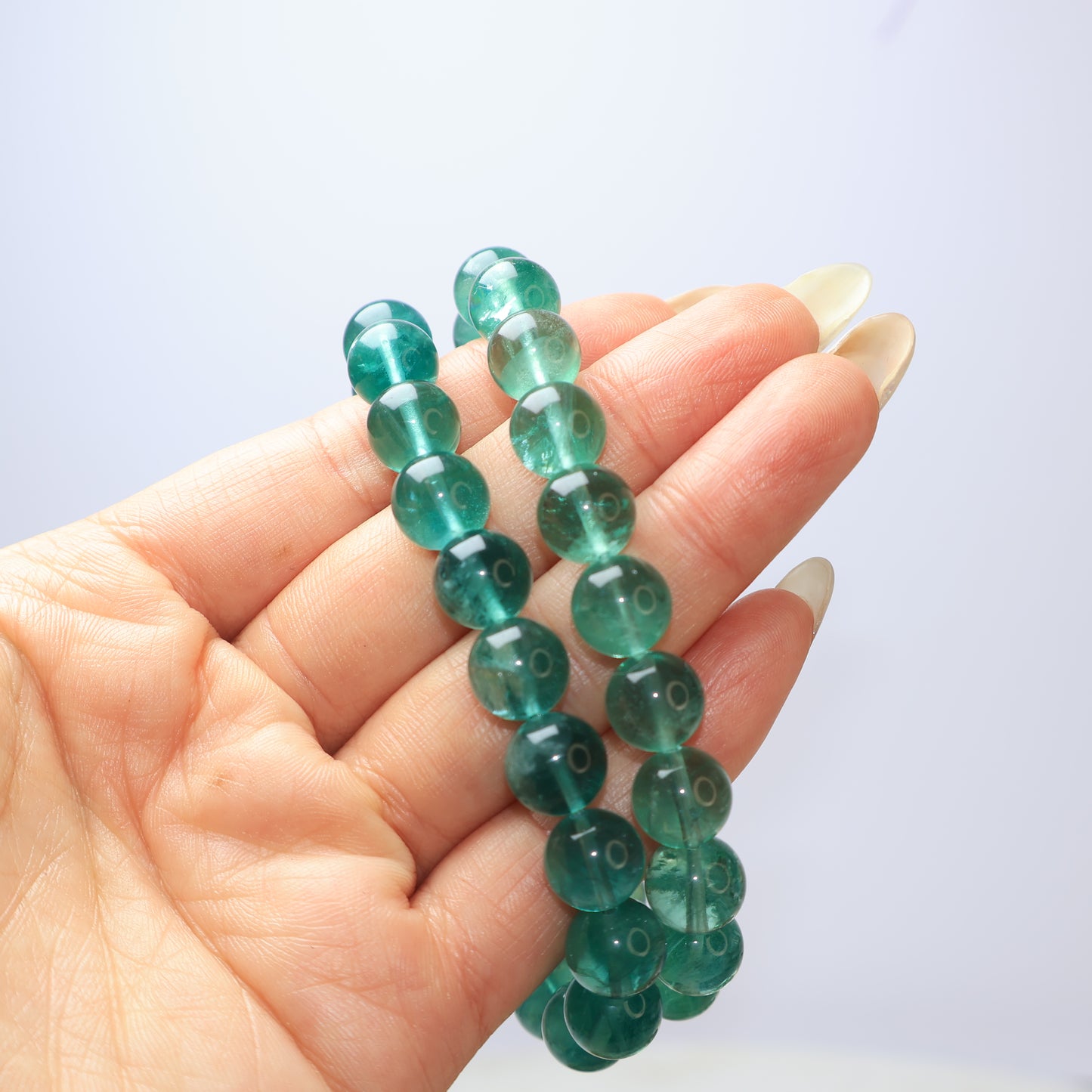 Two Natural Green Fluorite Bracelets in Hand