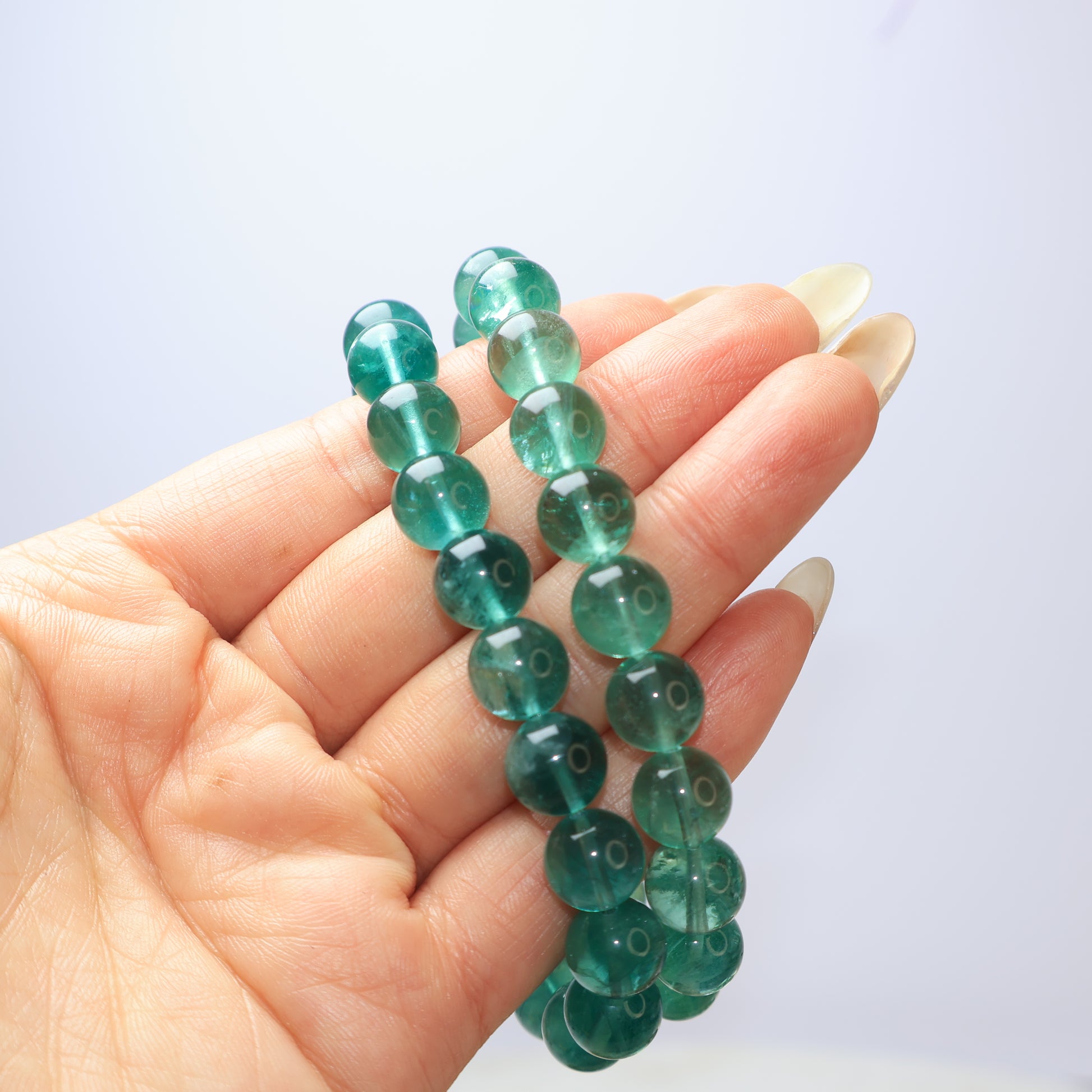 Two Natural Green Fluorite Bracelets in Hand