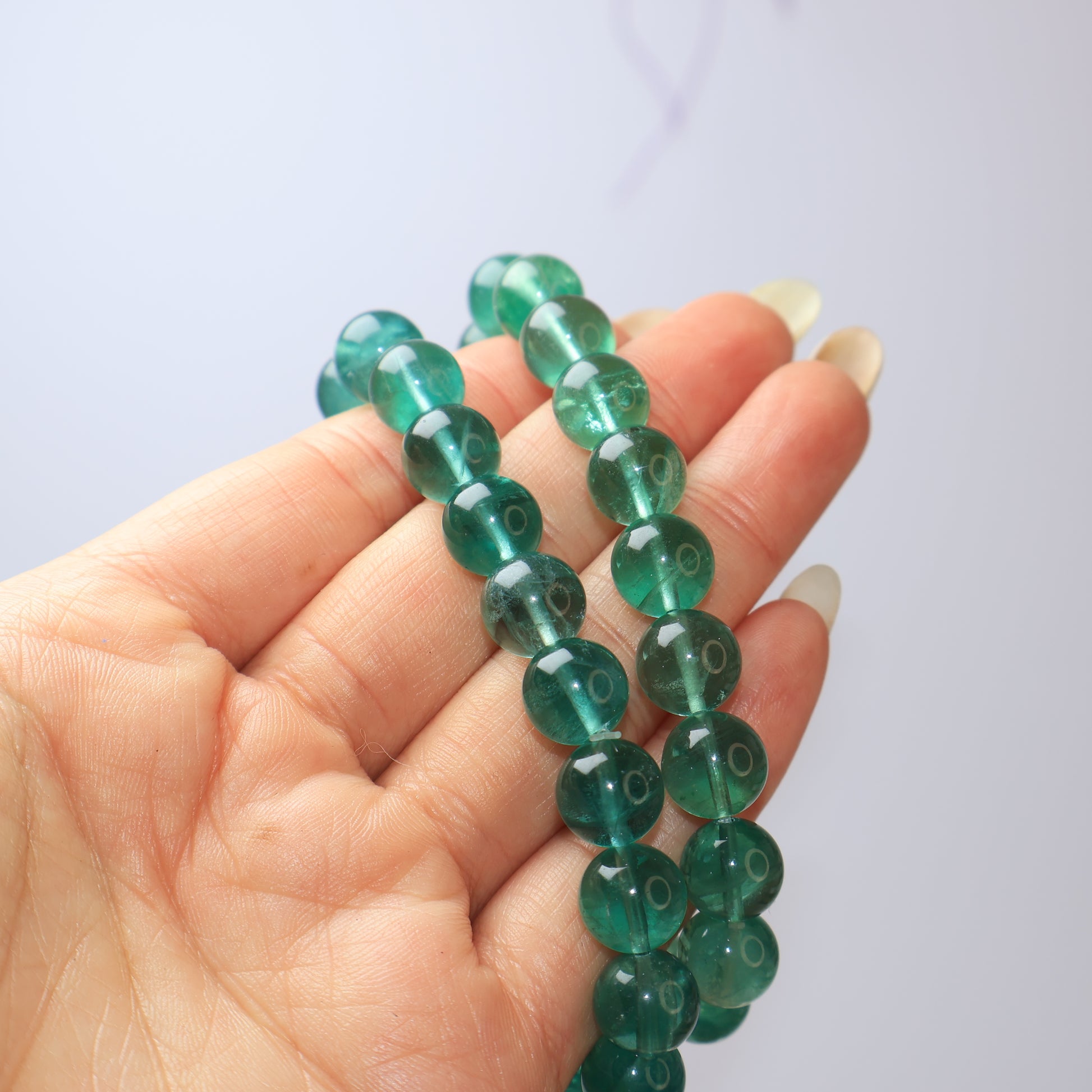 Two Natural Green Fluorite Bracelets in Hand