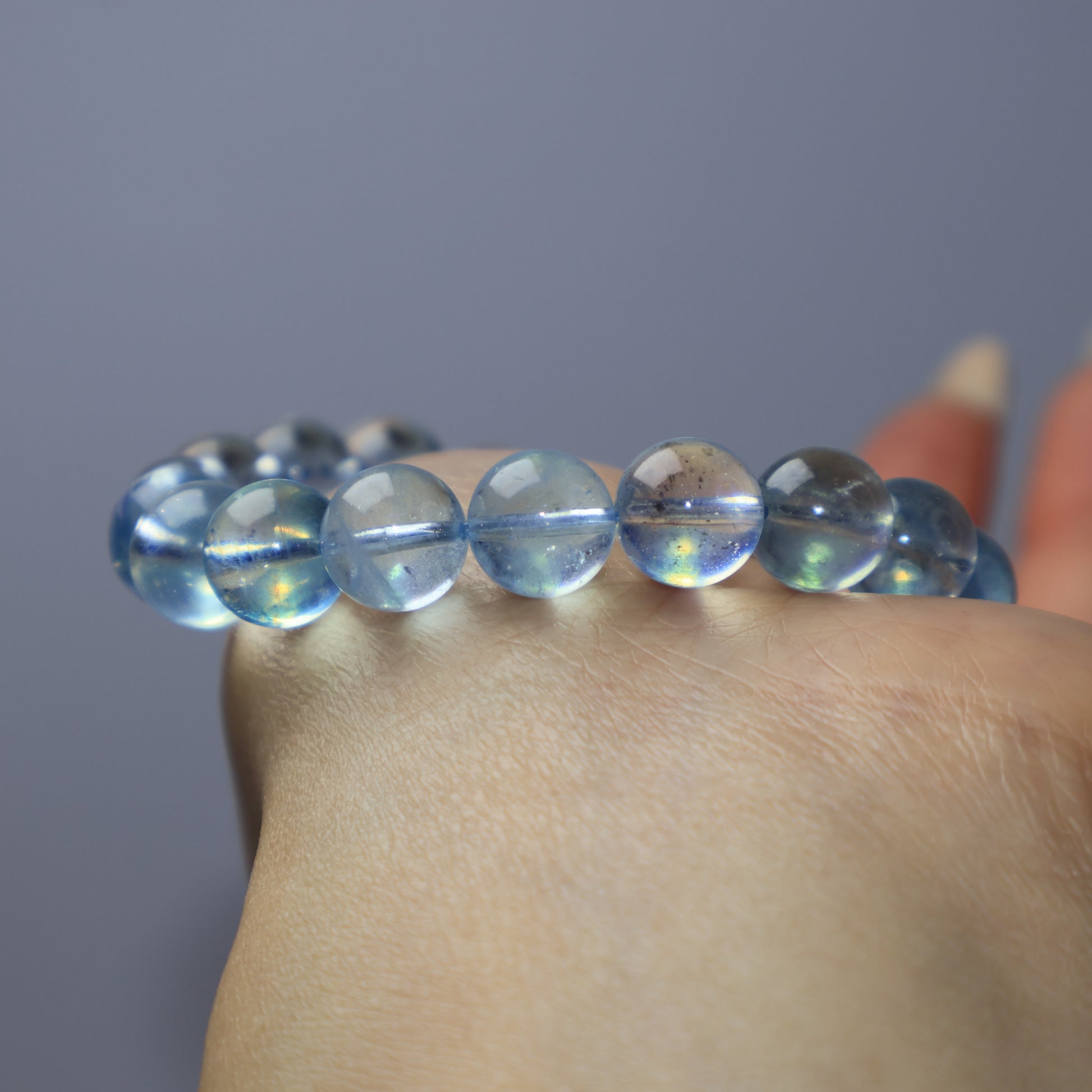 Detailed view of genuine Aquamarine beads showing natural inclusions