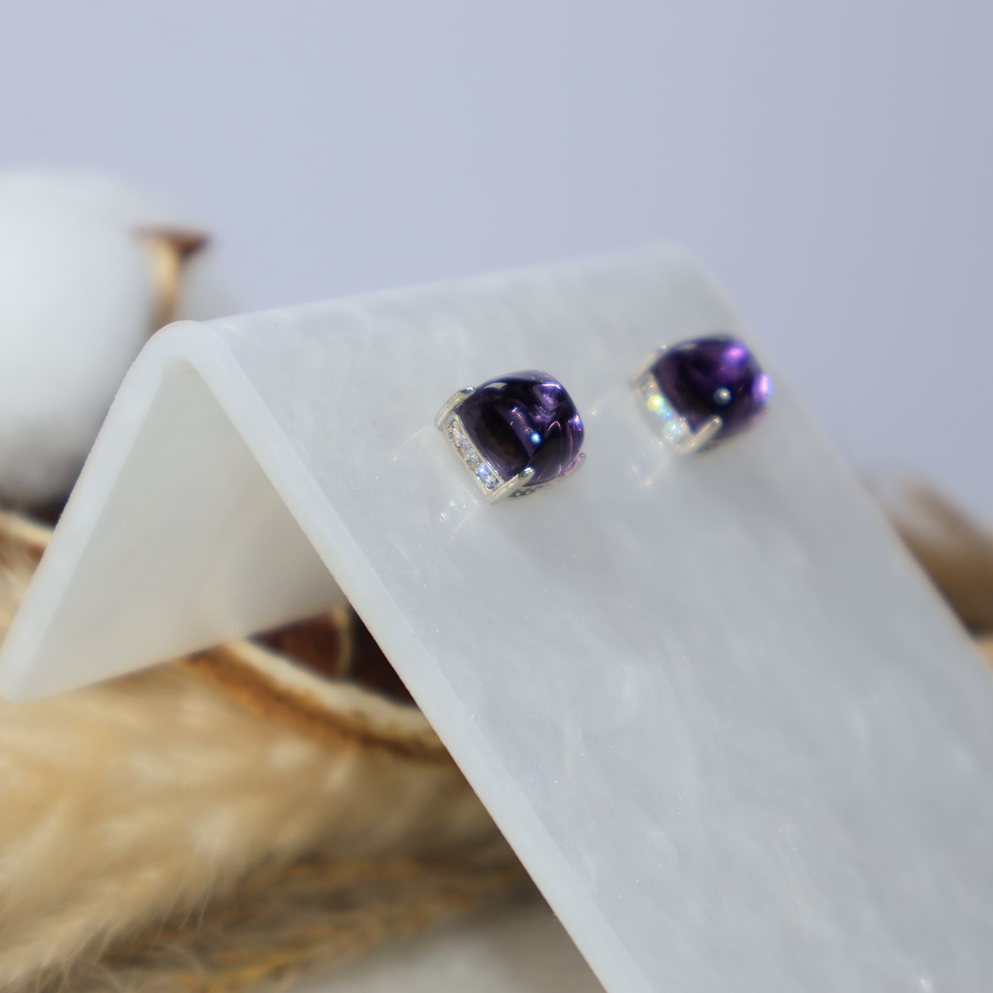 Side view of genuine amethyst sterling silver stud earrings