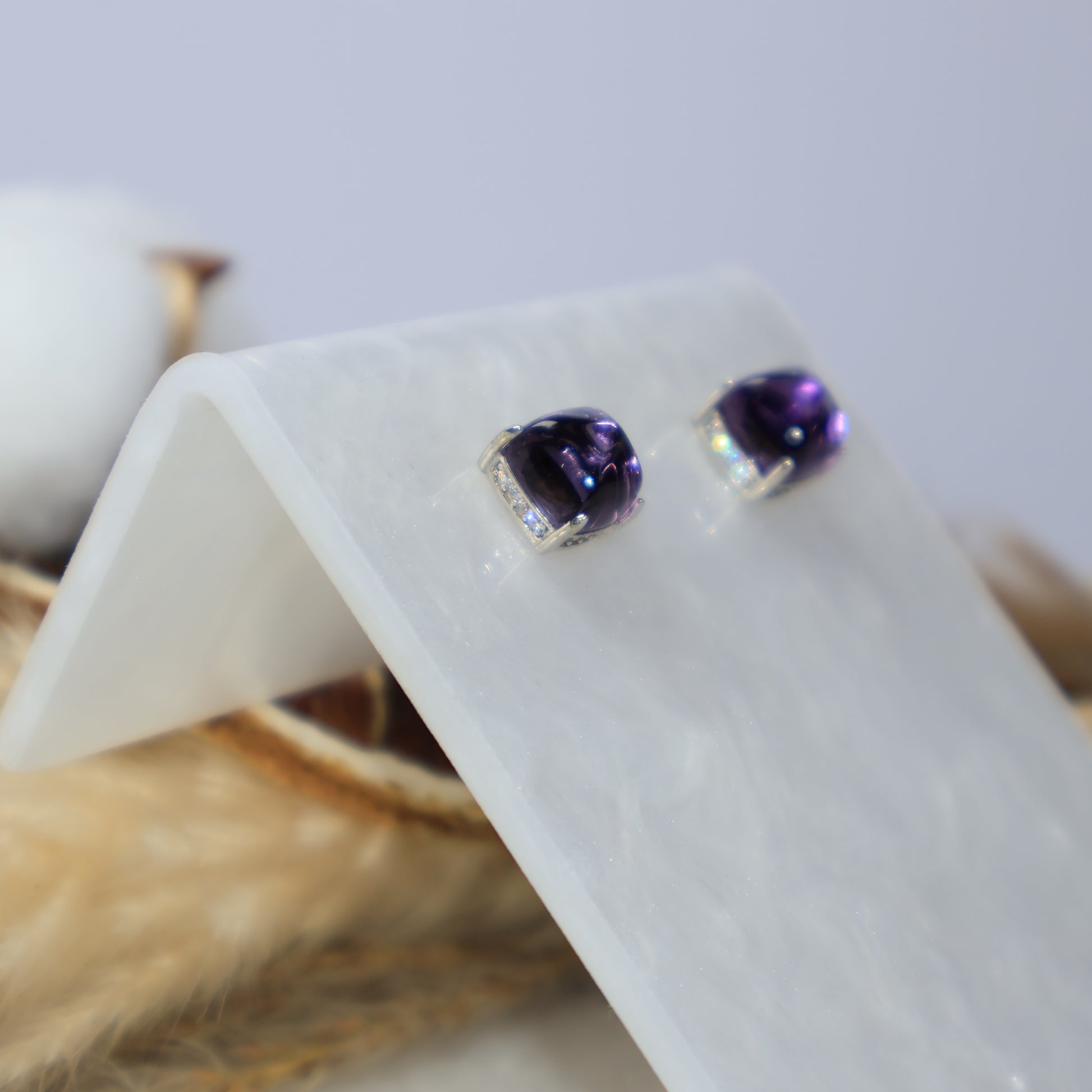 Side view of genuine amethyst sterling silver stud earrings
