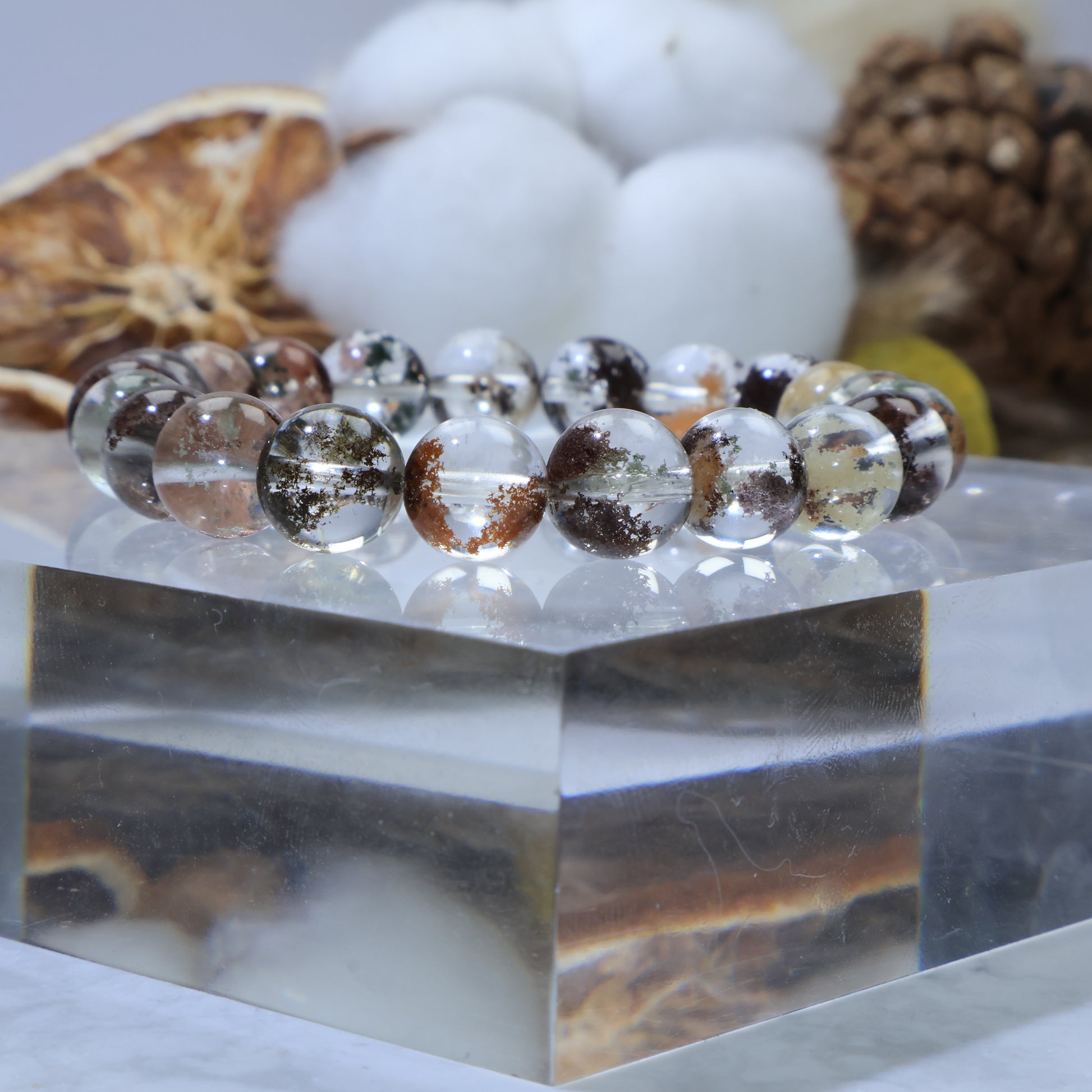 Side angle close-up of Scenic Phantom Quartz beads showing garden-like inclusions