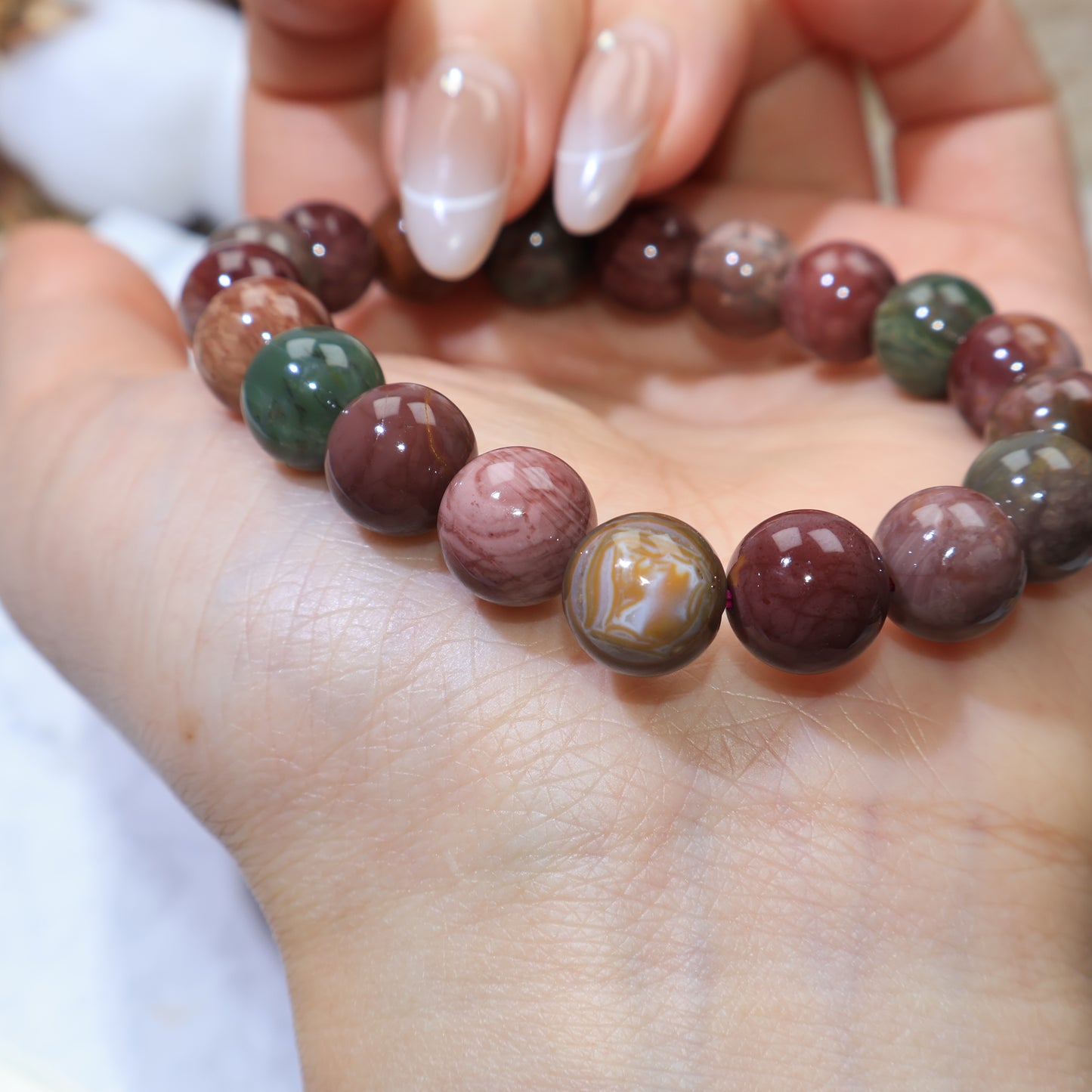Angle view showing contrasting green and reddish-brown beads